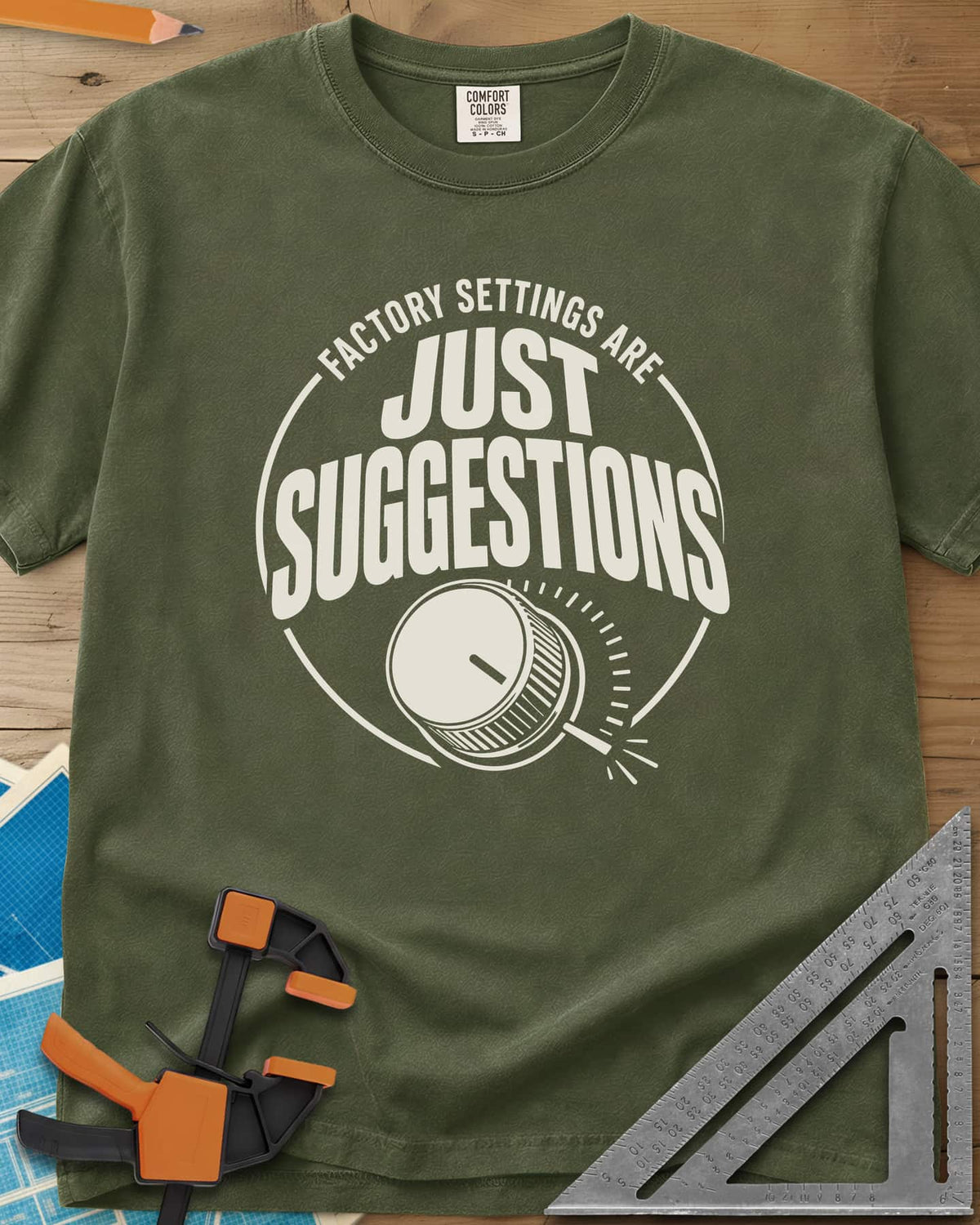 Factory Suggestions heavyweight tee in Hemp, a round badge with a dial knob and tick marks