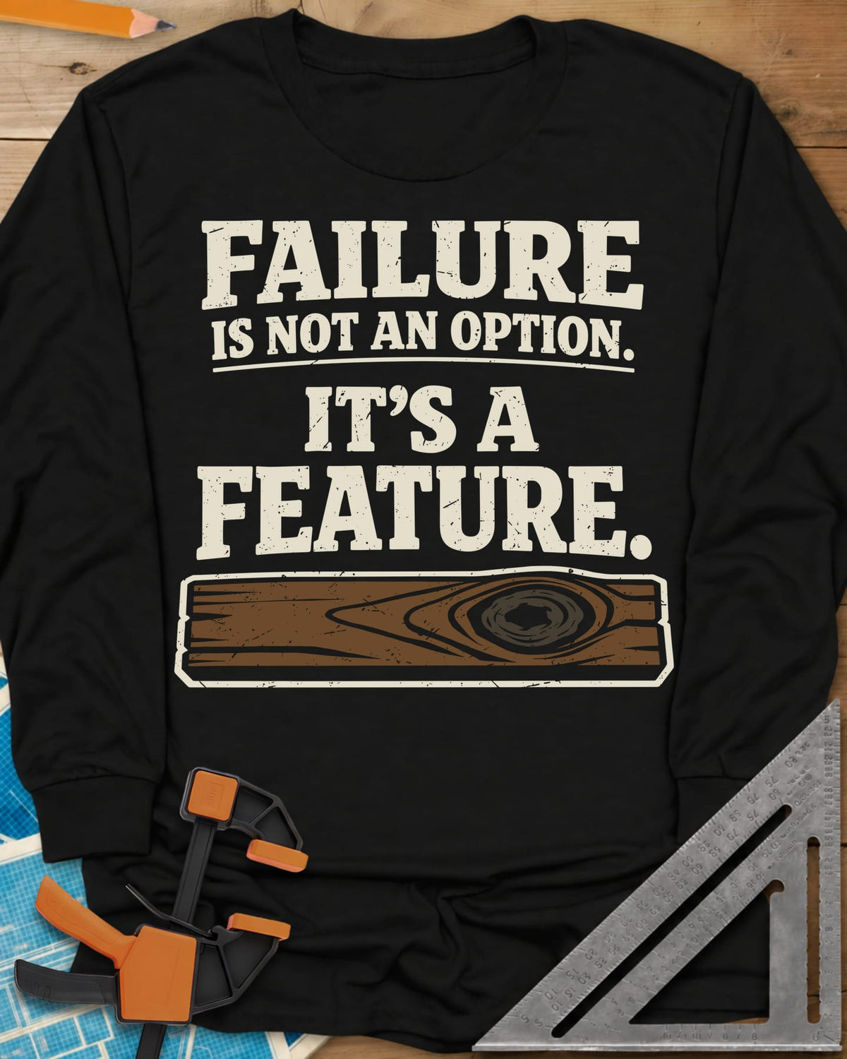 Failure Is A Feature long sleeve shirt in Black, a knotty plank with a swirling knot under the slogan