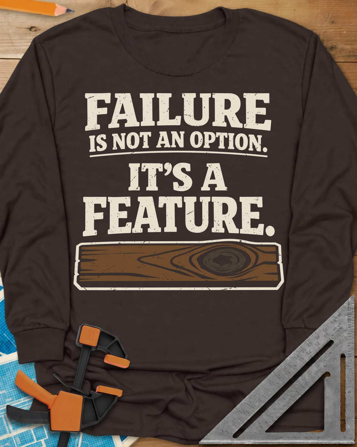 Failure Is A Feature long sleeve shirt in Dark Chocolate, a knotty plank with a swirling knot under the slogan