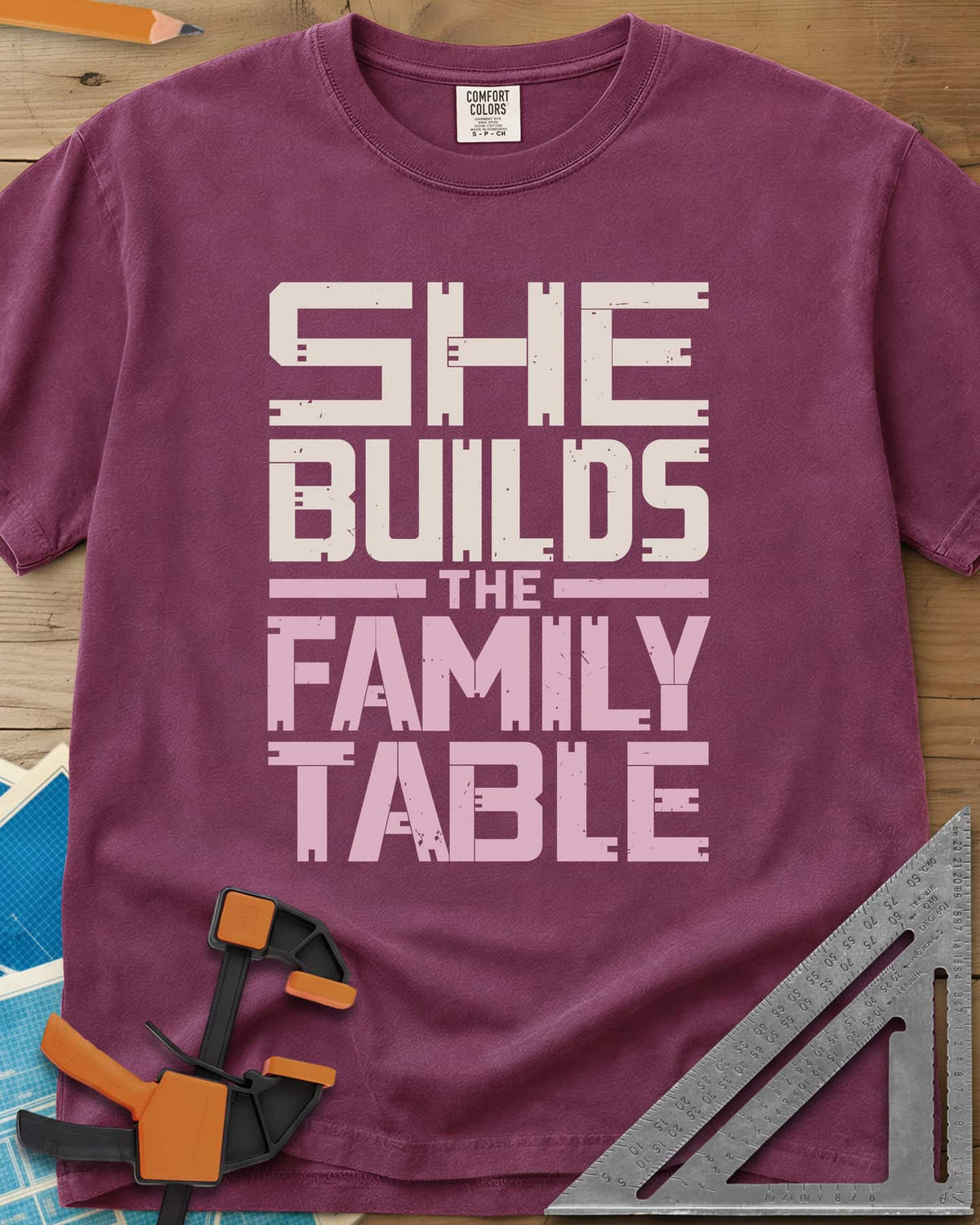 Family Table heavyweight tee in Berry, stacked block letters with notches cut like joinery