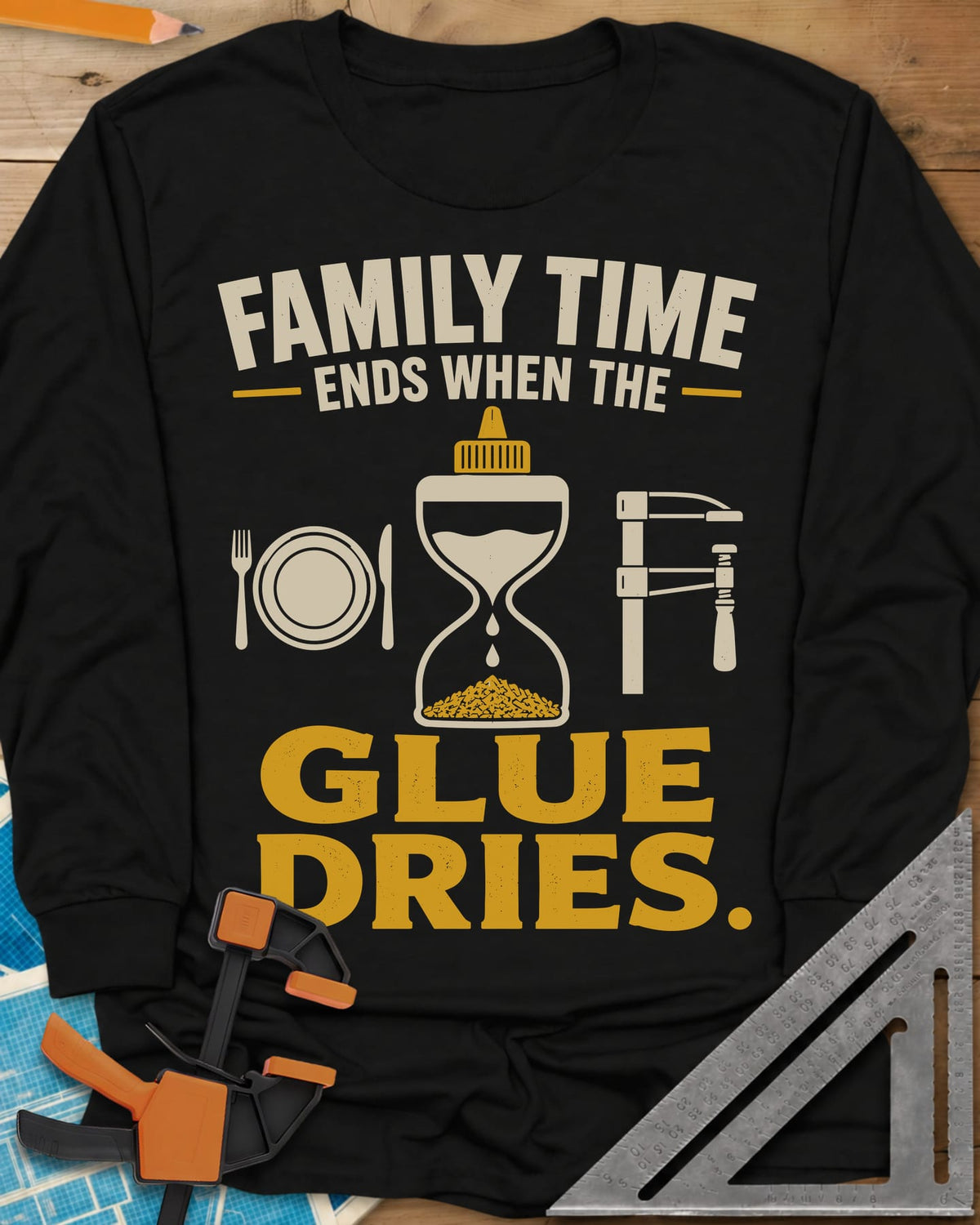 Family Time Ends When The Glue Dries long sleeve shirt in Black, a place setting, a glue-bottle hourglass and a bar clamp