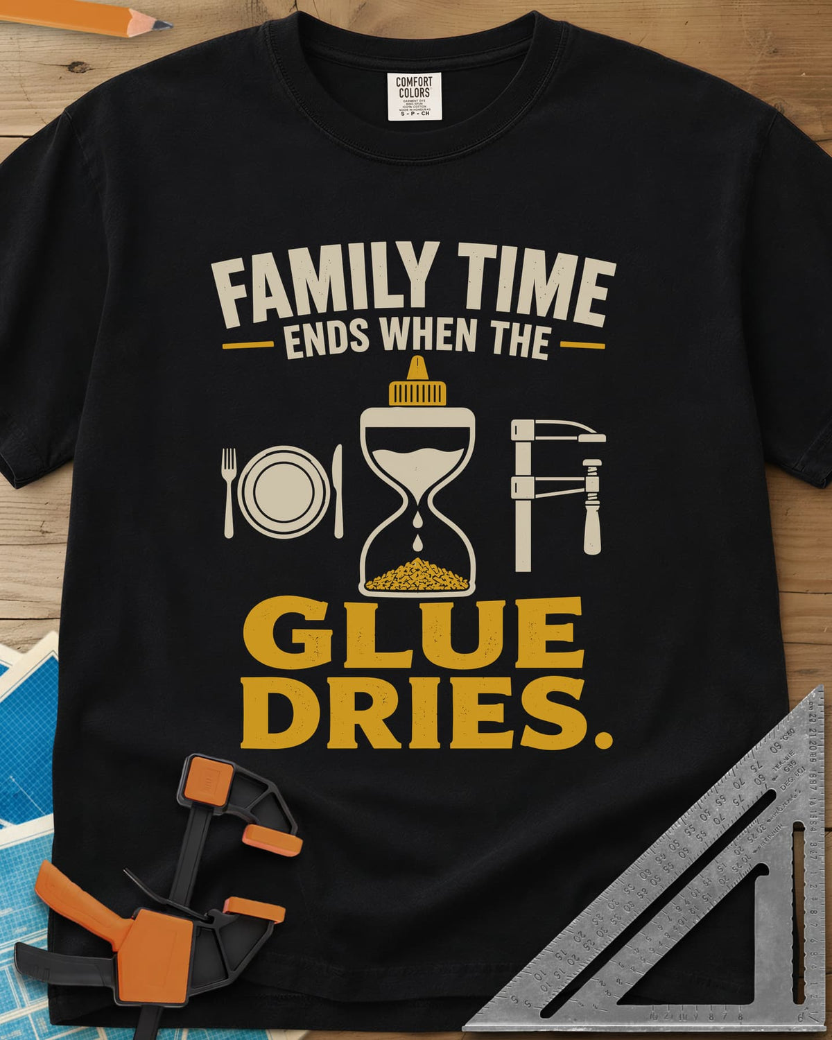 Family Time Ends When The Glue Dries heavyweight tee in Black, a place setting, a glue-bottle hourglass and a bar clamp