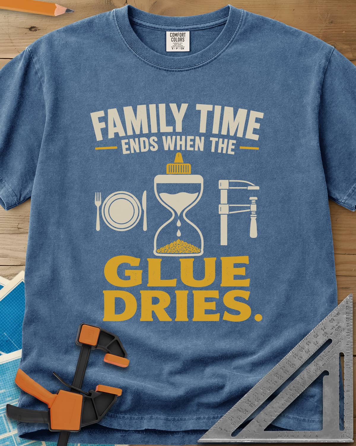 Family Time Ends When The Glue Dries heavyweight tee in Blue Jean, a place setting, a glue-bottle hourglass and a bar clamp