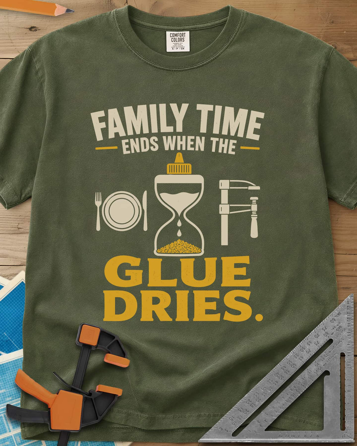 Family Time Ends When The Glue Dries heavyweight tee in Hemp, a place setting, a glue-bottle hourglass and a bar clamp