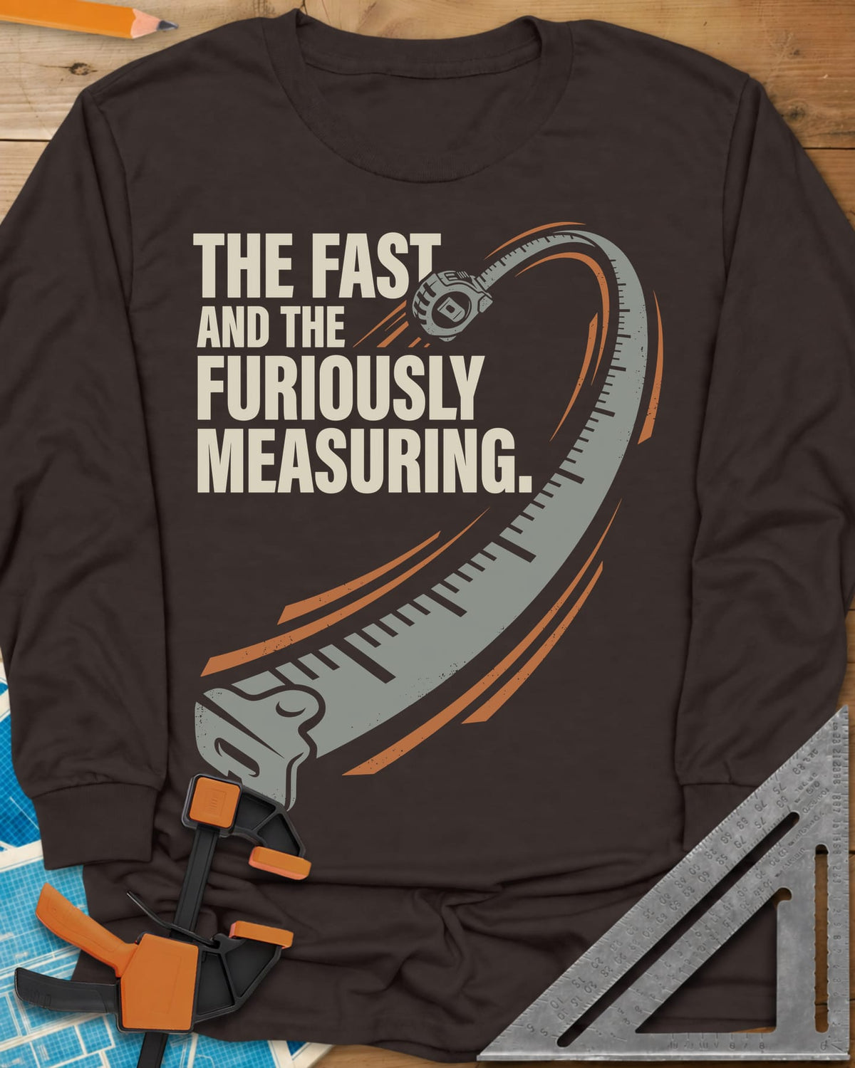 Fast And Furiously Measuring long sleeve shirt in Dark Chocolate, a tape measure whipping through the air with speed lines