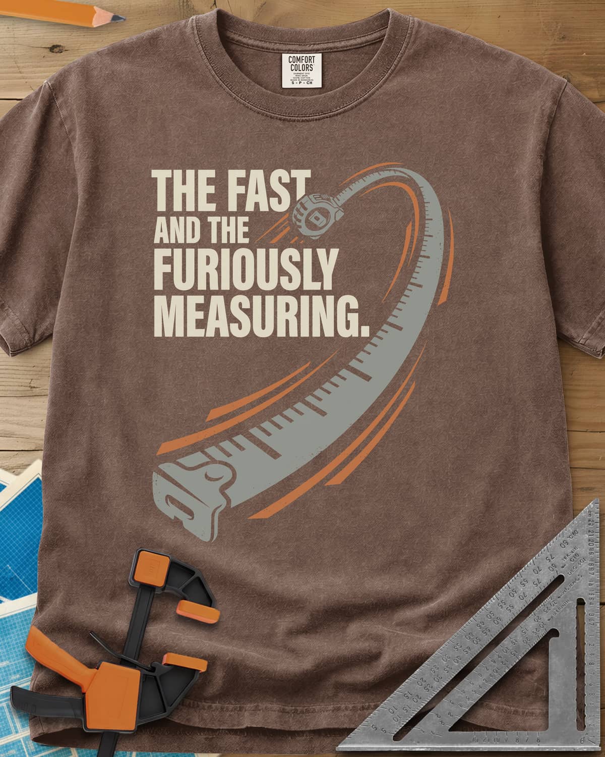 Fast And Furiously Measuring heavyweight tee in Espresso, a tape measure whipping through the air with speed lines