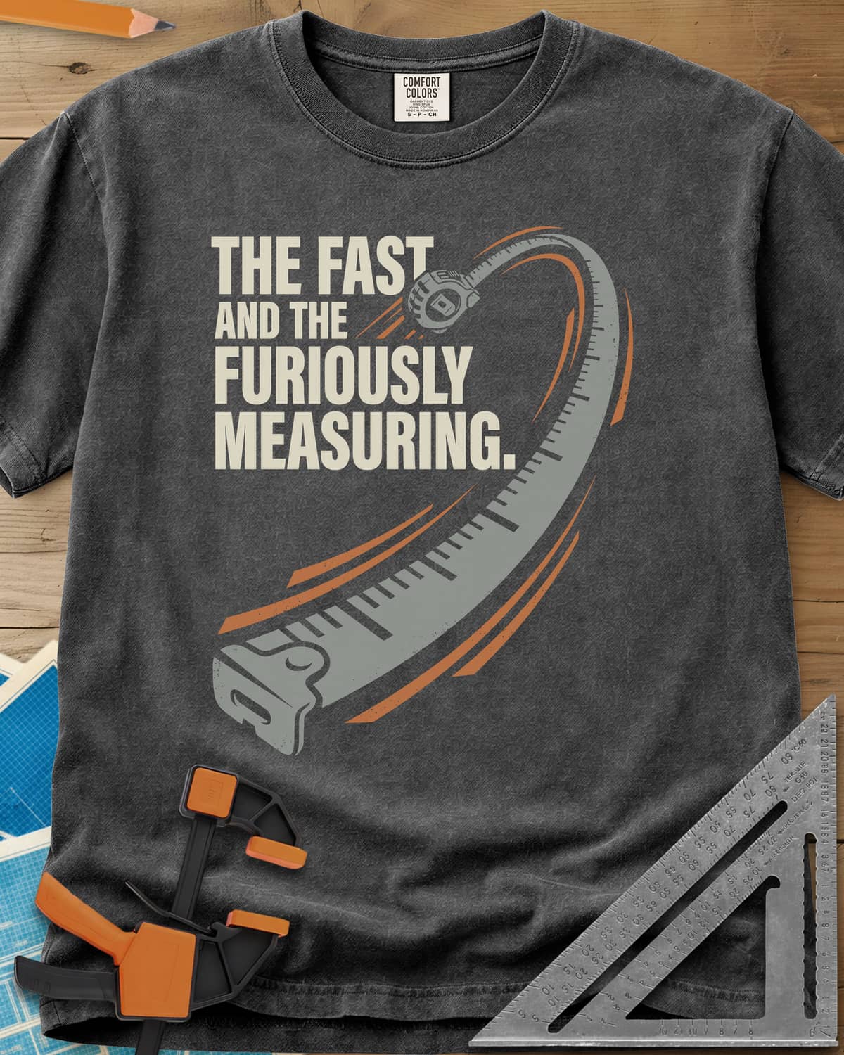 Fast And Furiously Measuring heavyweight tee in Pepper, a tape measure whipping through the air with speed lines