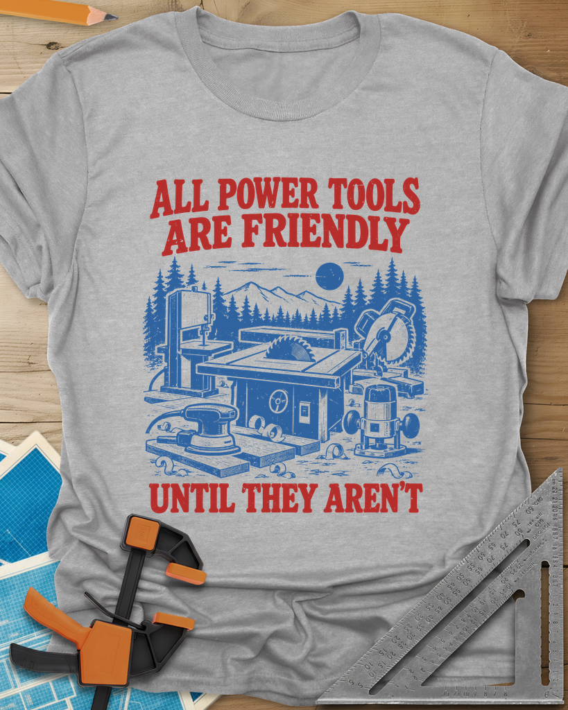 Friendly Tools t-shirt in Sport Grey, a table saw, bandsaw, miter saw, sander and router in a forest