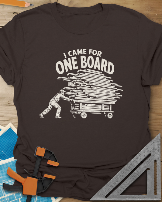 One Board Haul t-shirt in Dark Chocolate, a man pushing a flatbed cart piled high with lumber