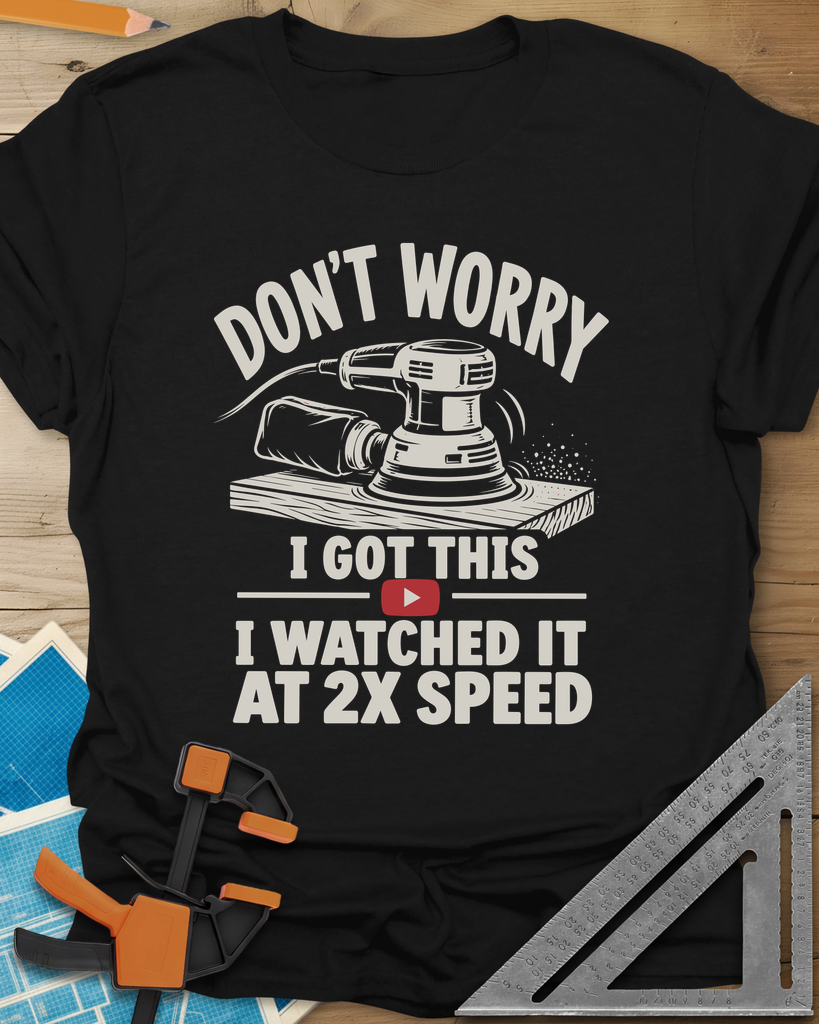 2x Speed t-shirt in Black, an orbital sander on a board beside a red video play button