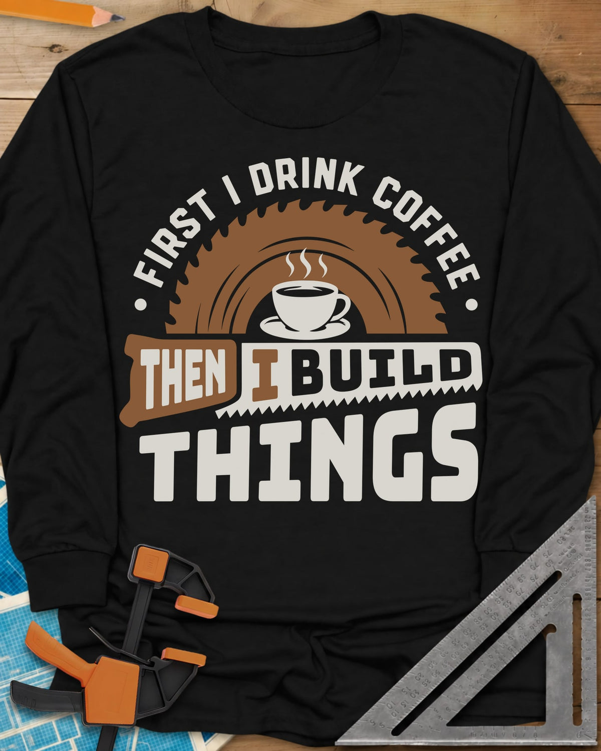 First I Drink Coffee Then I Build Things long sleeve shirt in Black, a steaming cup before a saw blade, with a handsaw