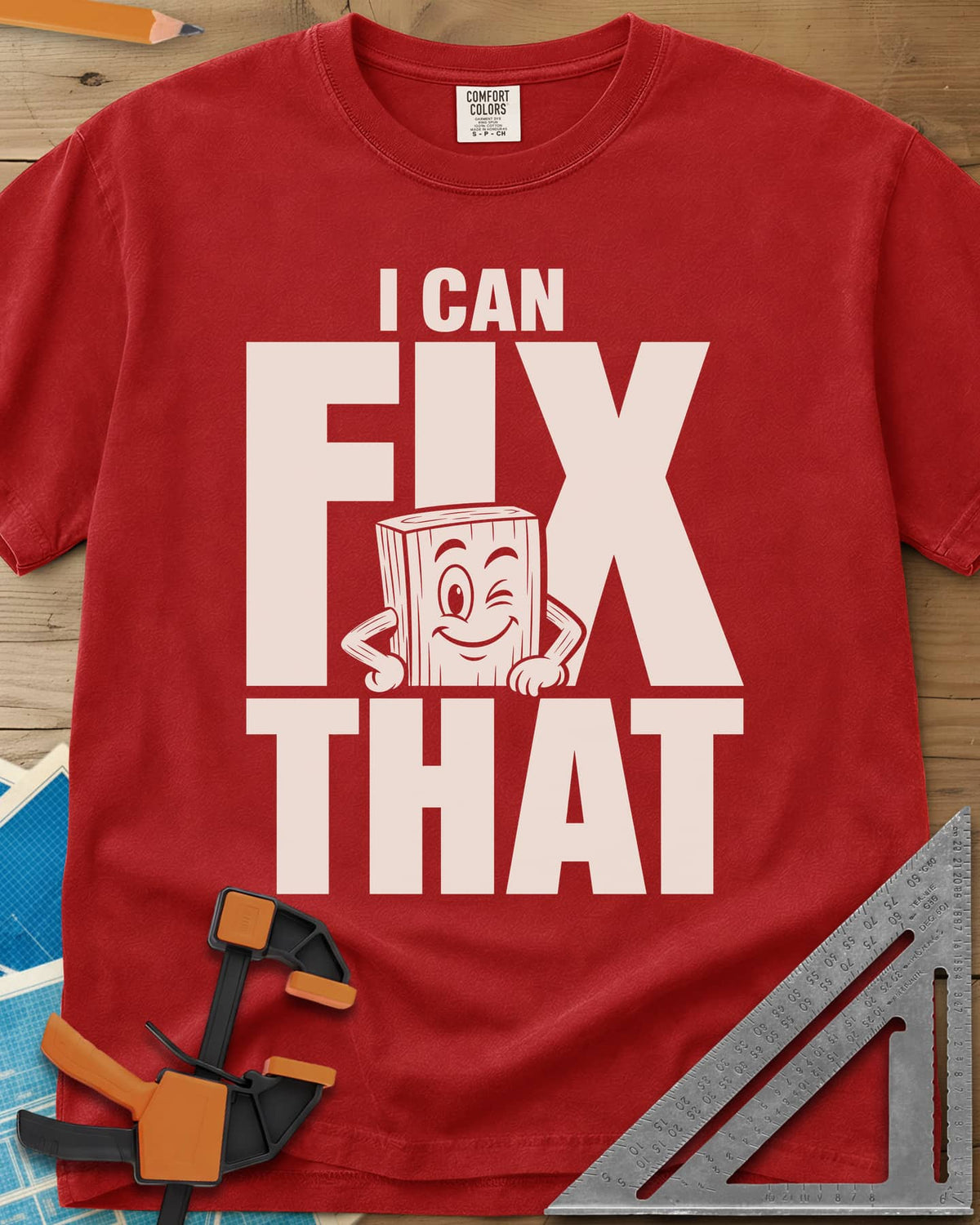 Fix That heavyweight tee in Red, a winking cartoon wood block peeking from behind big letters