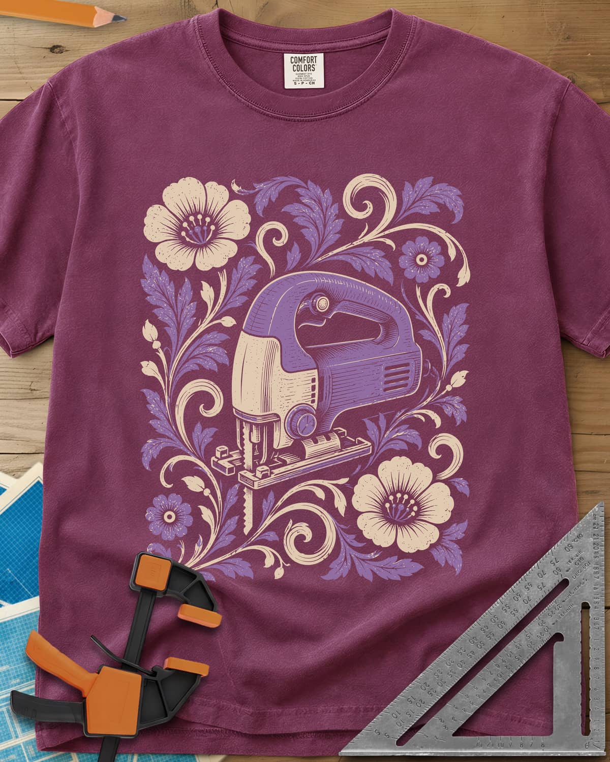 Floral Jigsaw heavyweight tee in Berry, a purple jigsaw wreathed in cream and purple flowers and leaves