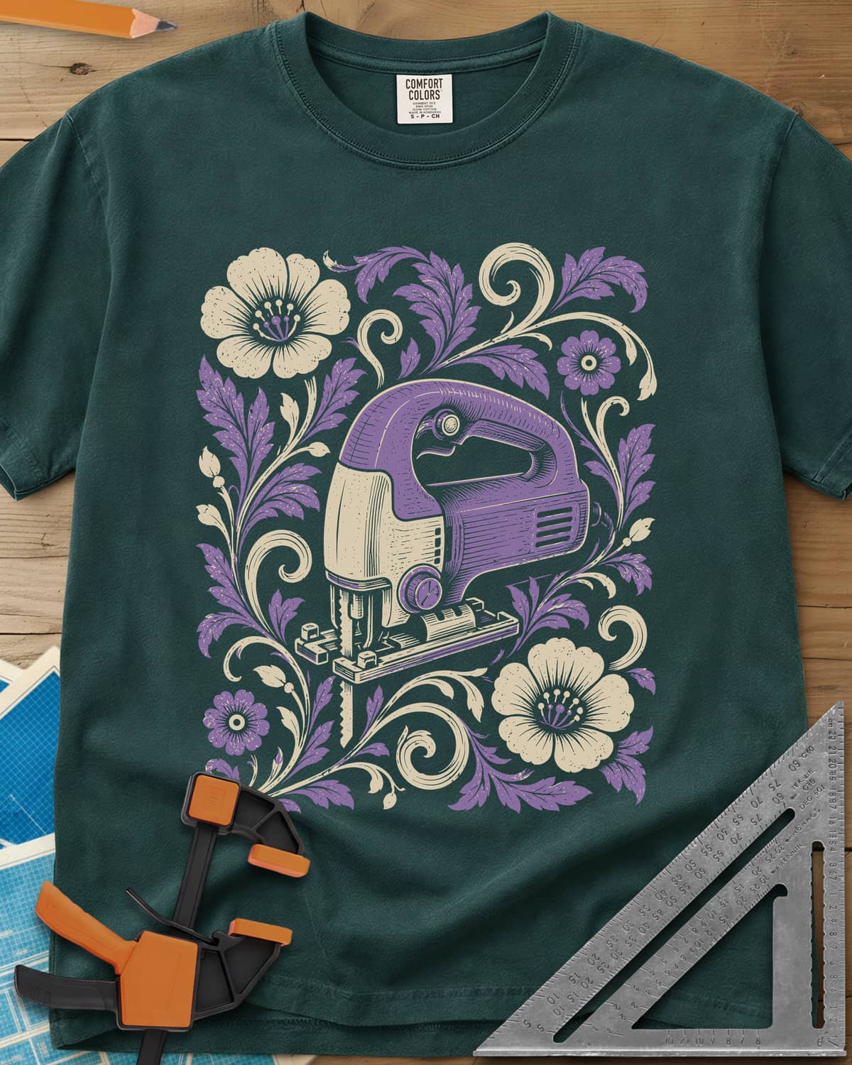 Floral Jigsaw heavyweight tee in Blue Spruce, a purple jigsaw wreathed in cream and purple flowers and leaves