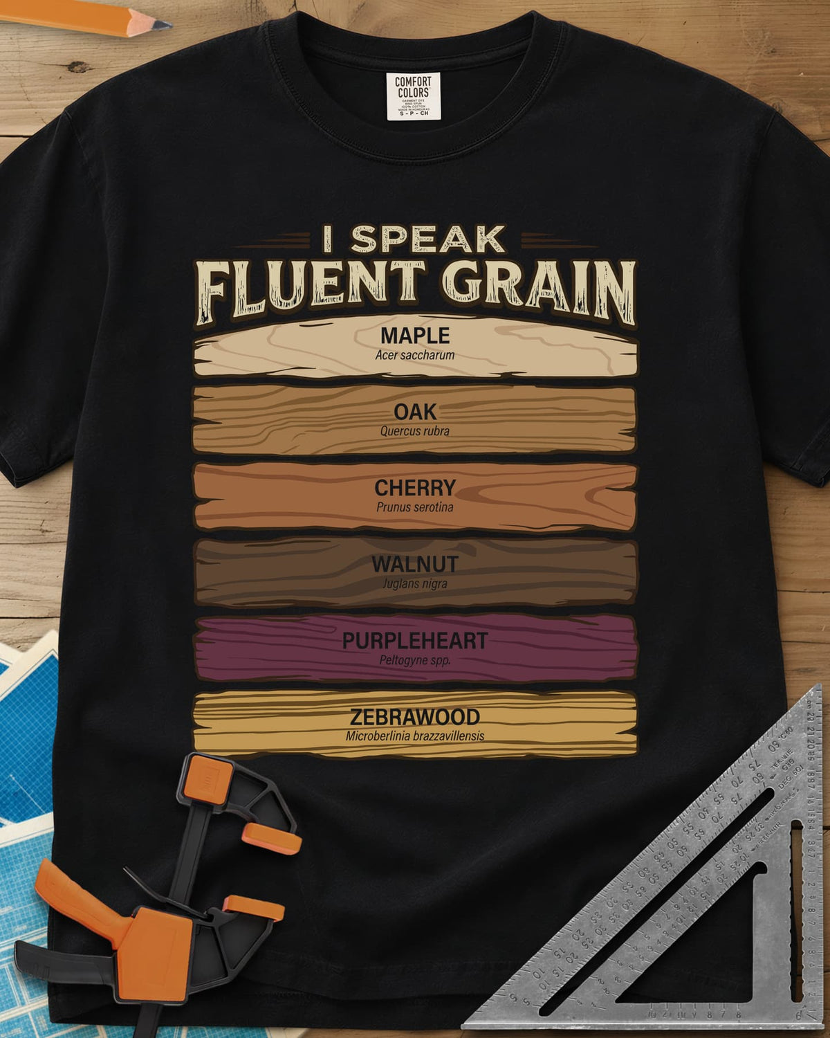 Fluent Grain heavyweight tee in Black, six wood plank swatches labeled maple, oak, cherry, walnut and more