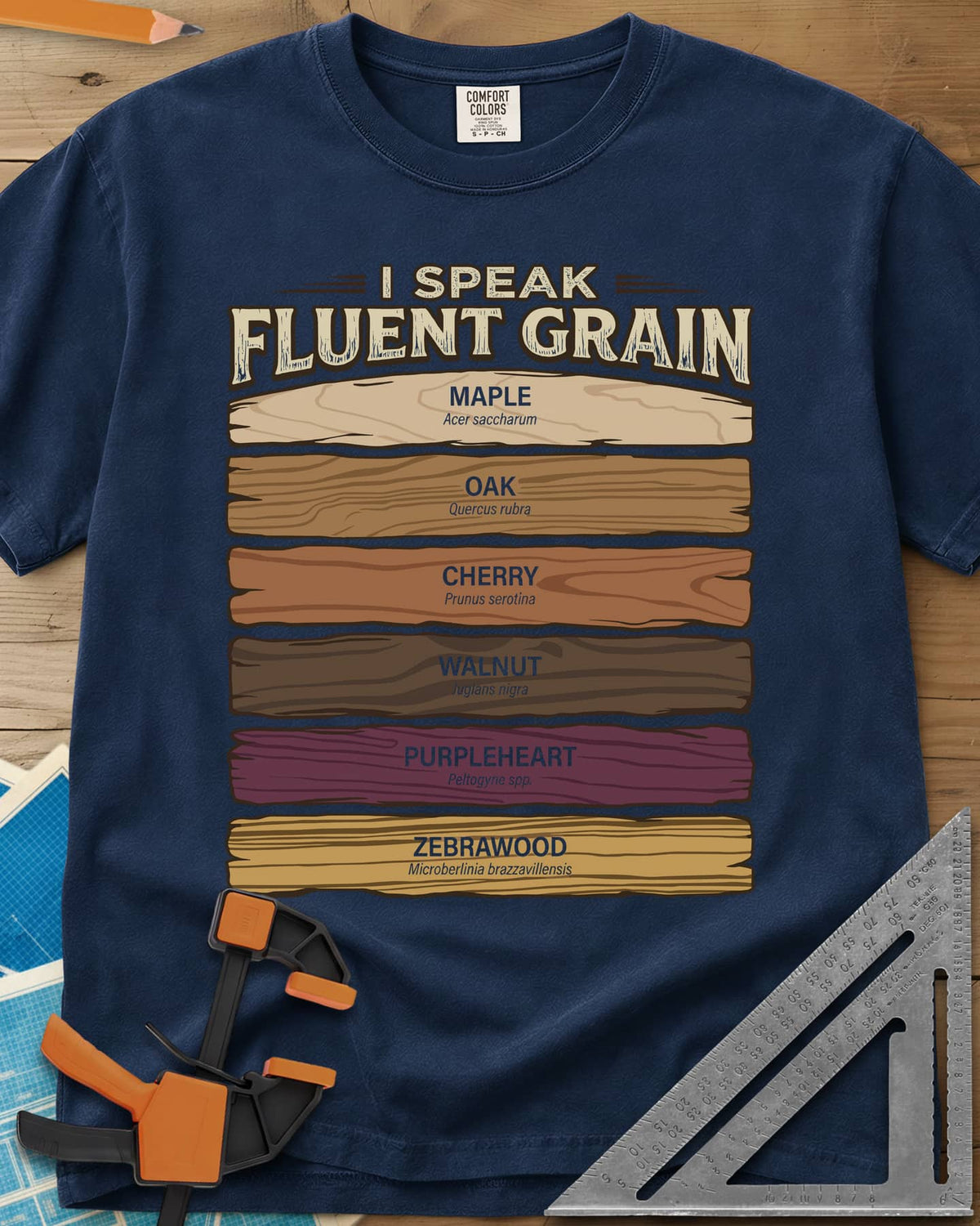 Fluent Grain heavyweight tee in Navy, six wood plank swatches labeled maple, oak, cherry, walnut and more