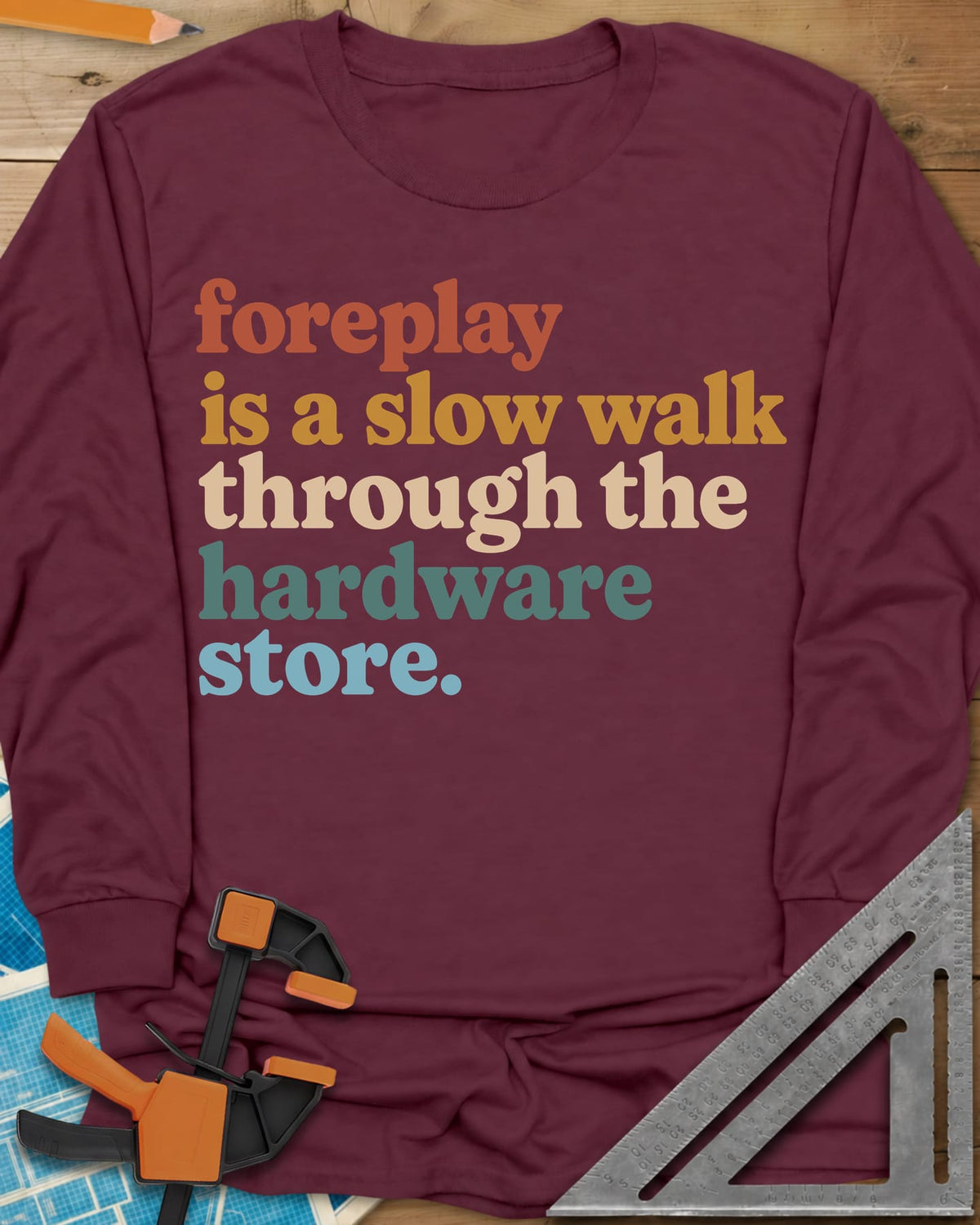 Foreplay Hardware Store long sleeve shirt in Maroon, stacked lowercase lettering in rust, mustard, cream, teal and blue