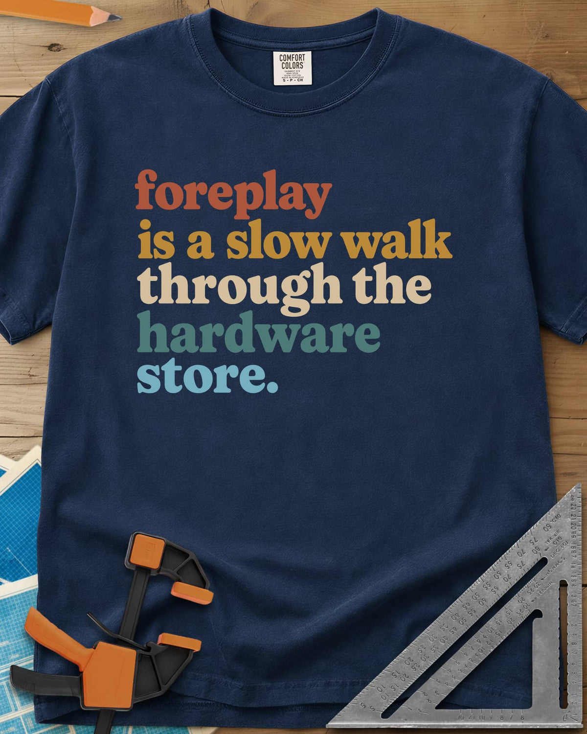 Foreplay Hardware Store heavyweight tee in Navy, stacked lowercase lettering in rust, mustard, cream, teal and blue
