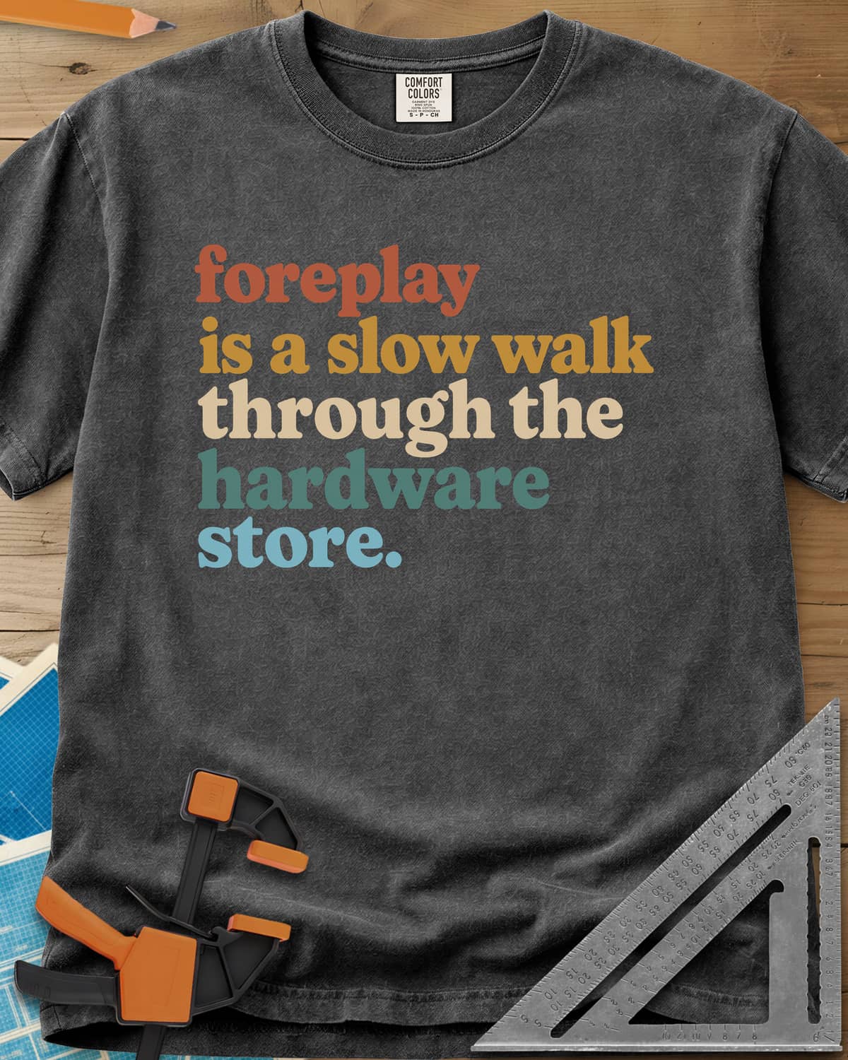 Foreplay Hardware Store heavyweight tee in Pepper, stacked lowercase lettering in rust, mustard, cream, teal and blue