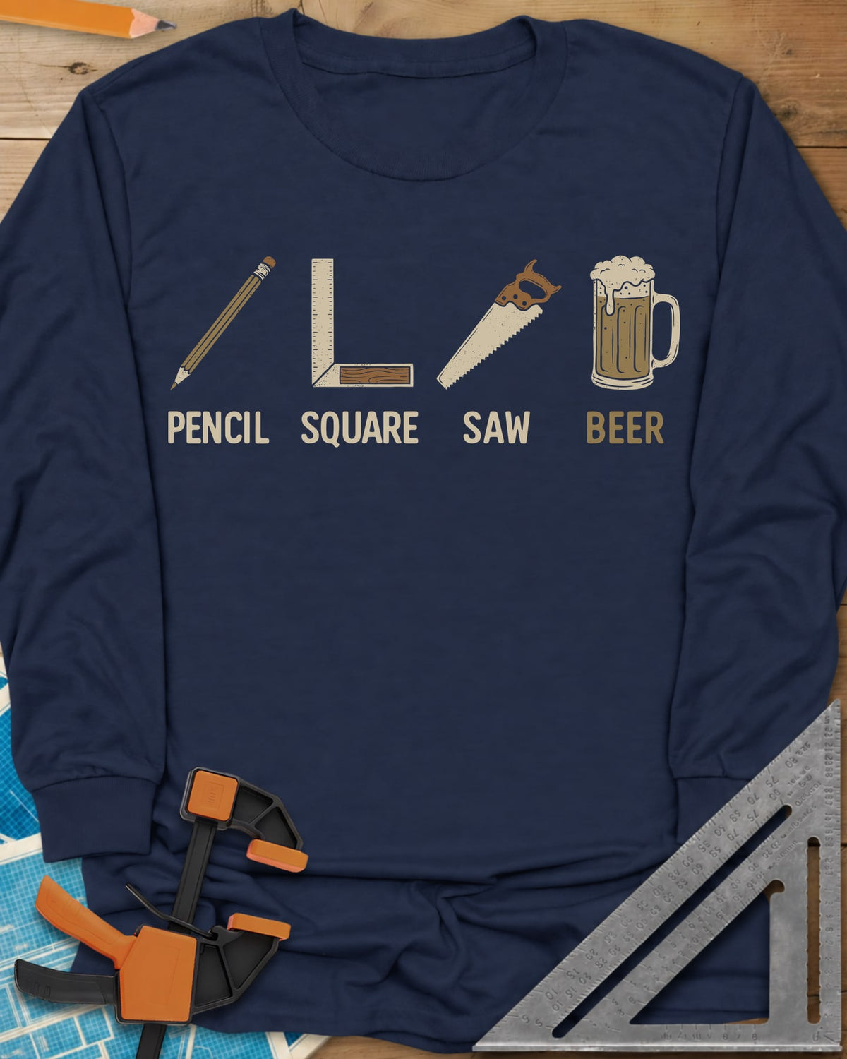 Four Essential Tools long sleeve shirt in Navy, a pencil, a try square, a handsaw and a frothy beer mug