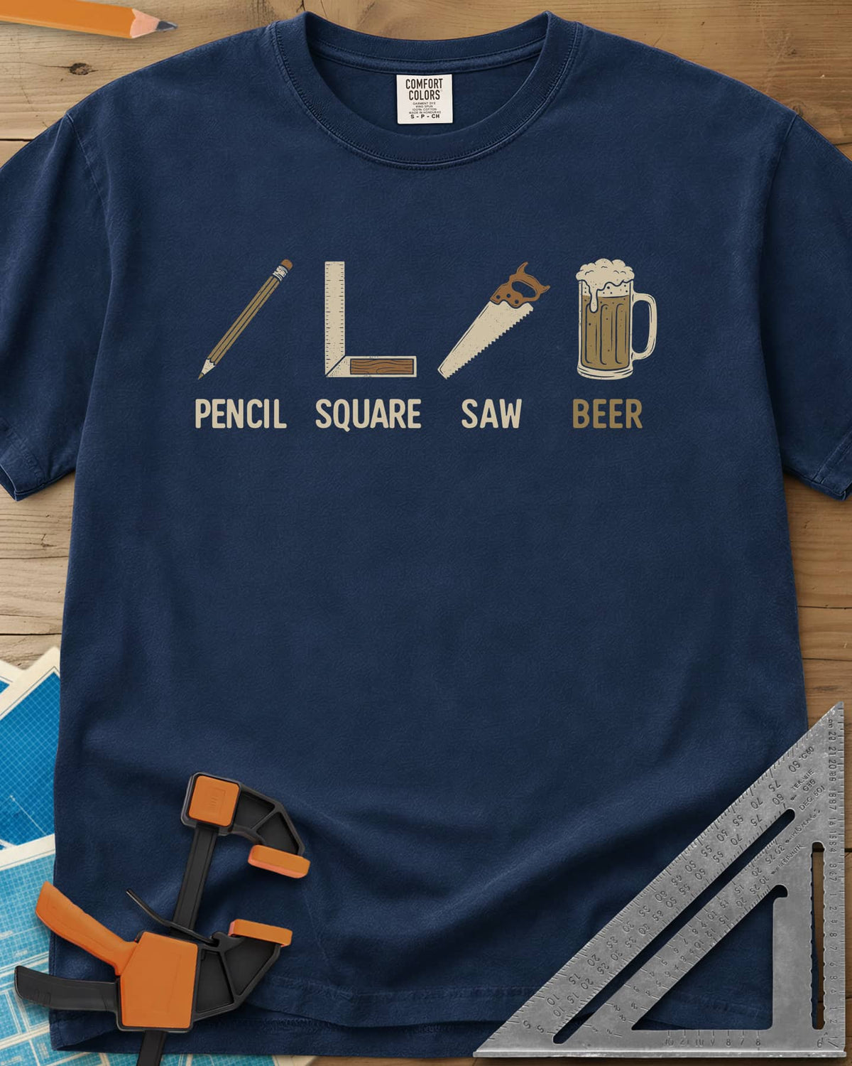 Four Essential Tools heavyweight tee in Navy, a pencil, a try square, a handsaw and a frothy beer mug