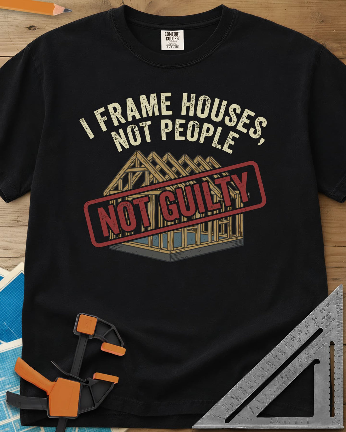 Frame Houses heavyweight tee in Black, a wood-framed house with a red NOT GUILTY stamp