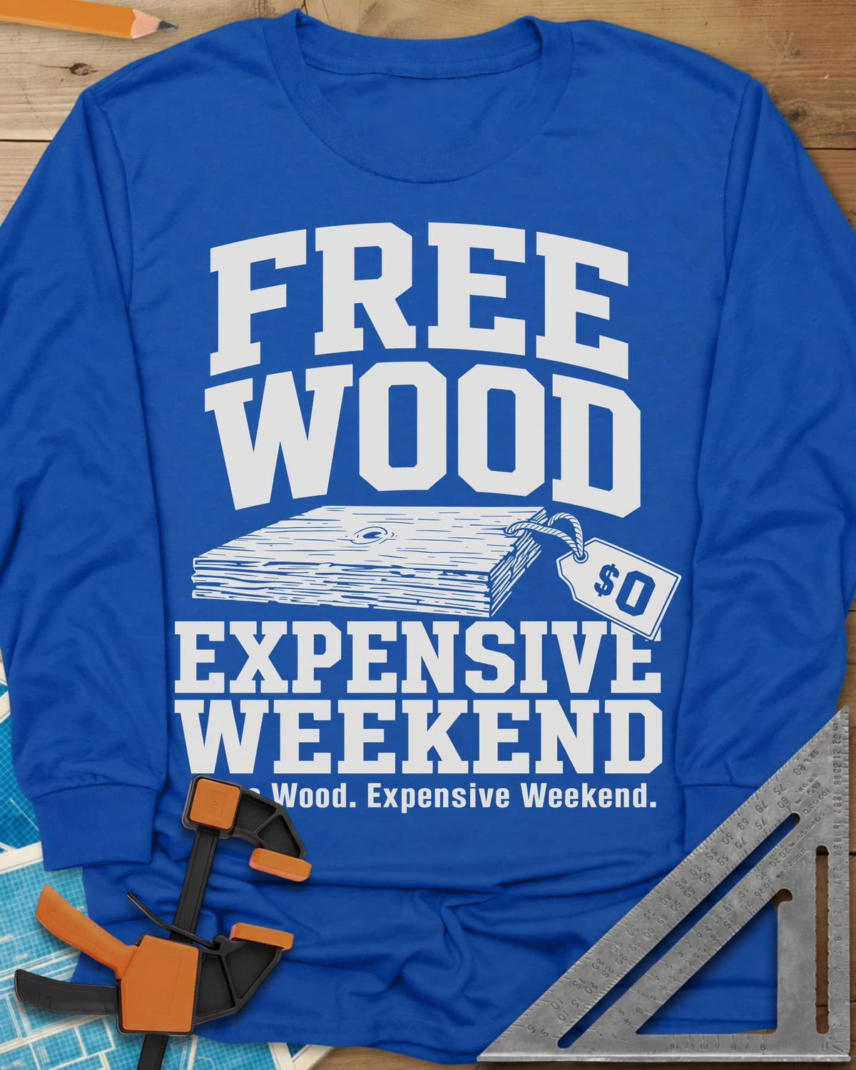 Free Wood long sleeve shirt in Royal, a stack of boards with a hang tag marked zero dollars
