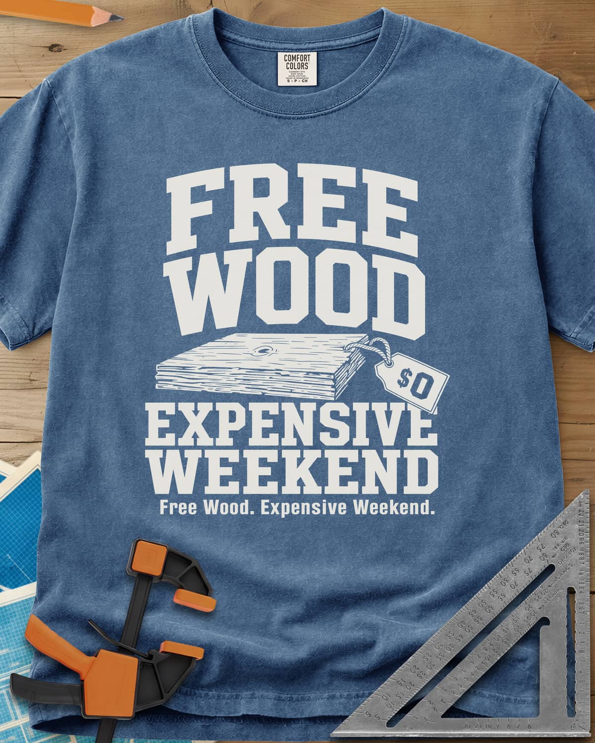 Free Wood heavyweight tee in Blue Jean, a stack of boards with a hang tag marked zero dollars