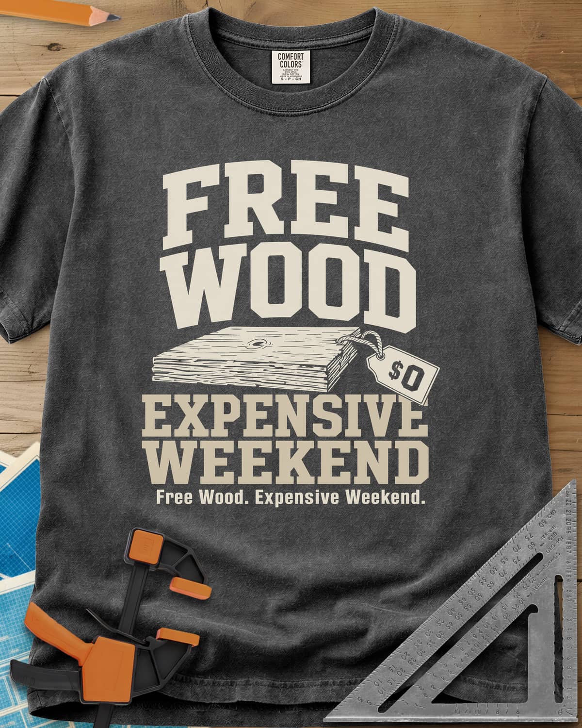 Free Wood heavyweight tee in Pepper, a stack of boards with a hang tag marked zero dollars