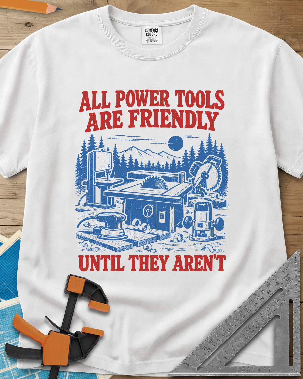 Friendly Tools heavyweight tee in White, a table saw, bandsaw, miter saw, sander and router in a forest