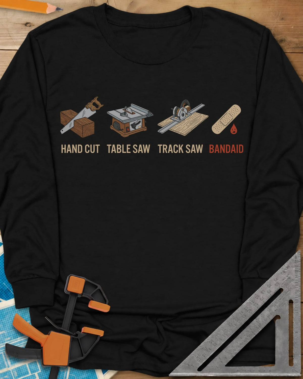 From Handsaw to Bandaid long sleeve shirt in Black, a handsaw, a table saw, a track saw and a bandage with a drop