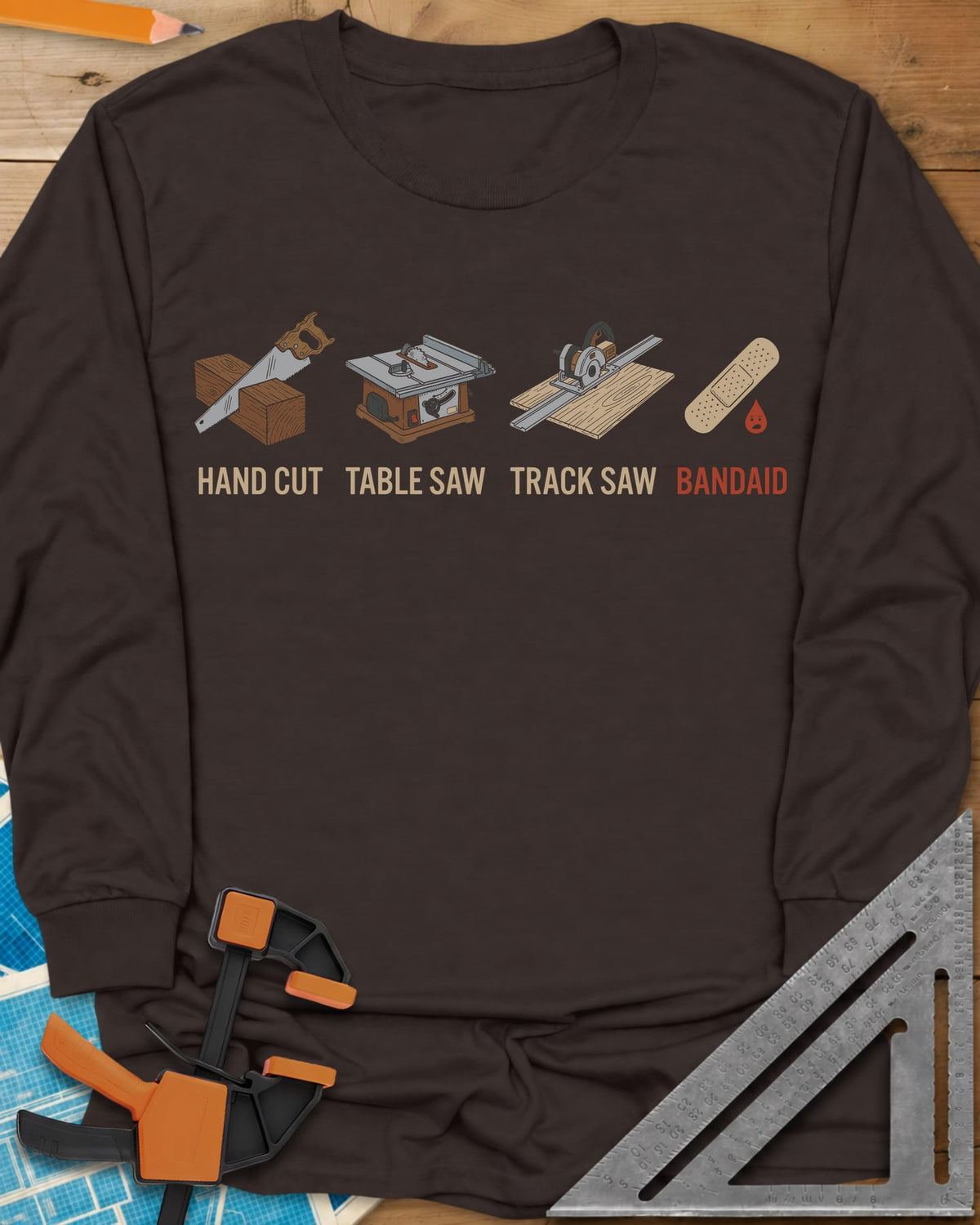 From Handsaw to Bandaid long sleeve shirt in Dark Chocolate, a handsaw, a table saw, a track saw and a bandage with a drop
