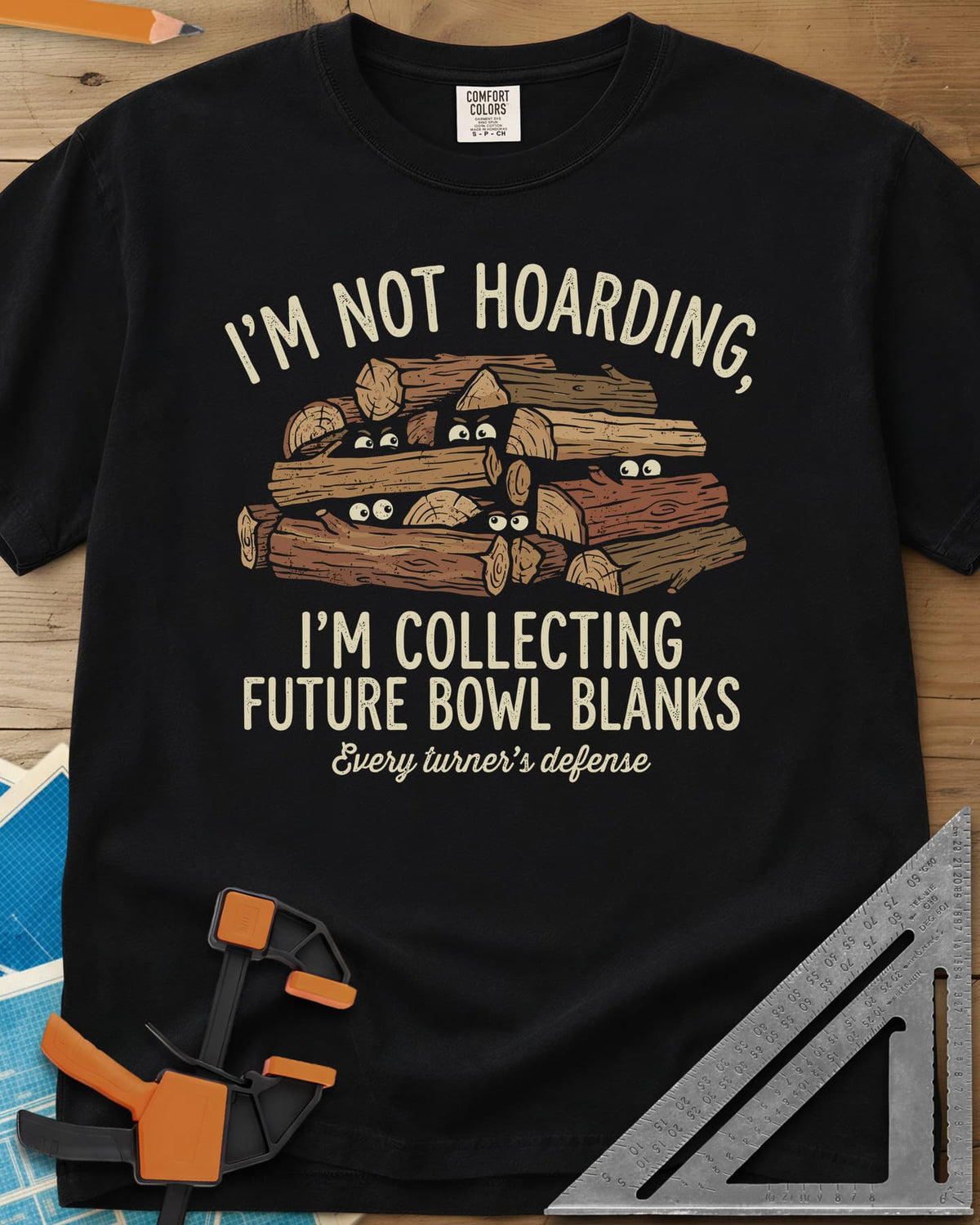 Future Bowl Blanks heavyweight tee in Black, a stack of logs with small eyes peeking out from between them
