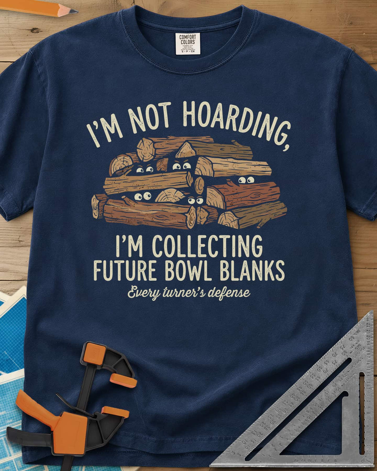 Future Bowl Blanks heavyweight tee in Navy, a stack of logs with small eyes peeking out from between them