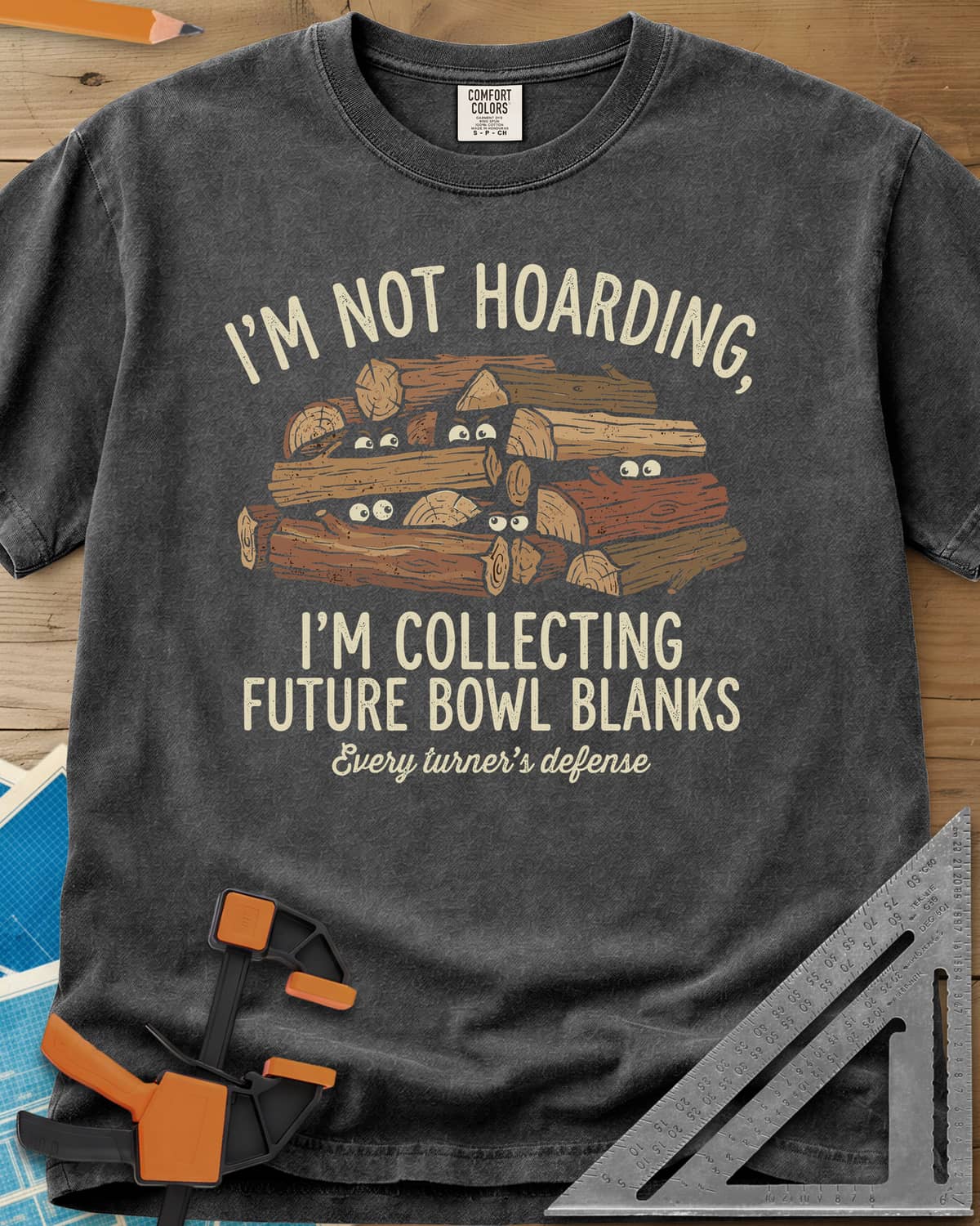 Future Bowl Blanks heavyweight tee in Pepper, a stack of logs with small eyes peeking out from between them