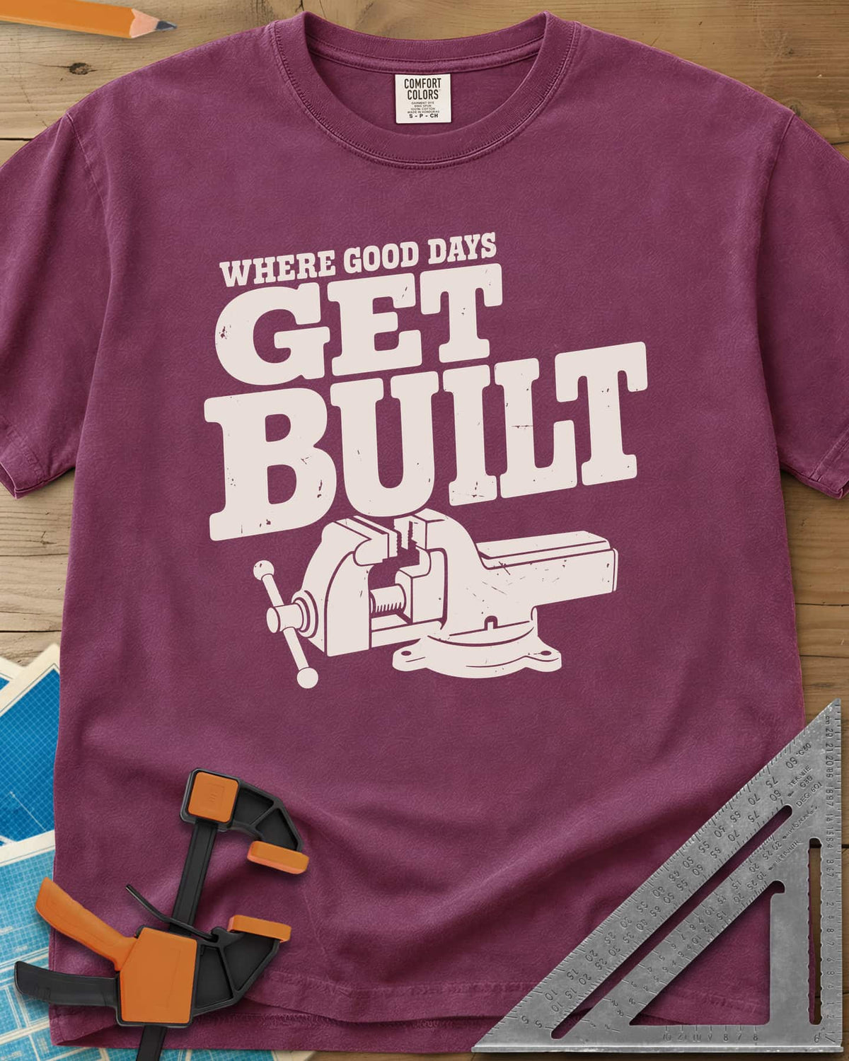 Get Built heavyweight tee in Berry, a swivel-base bench vise under bold slab-serif lettering