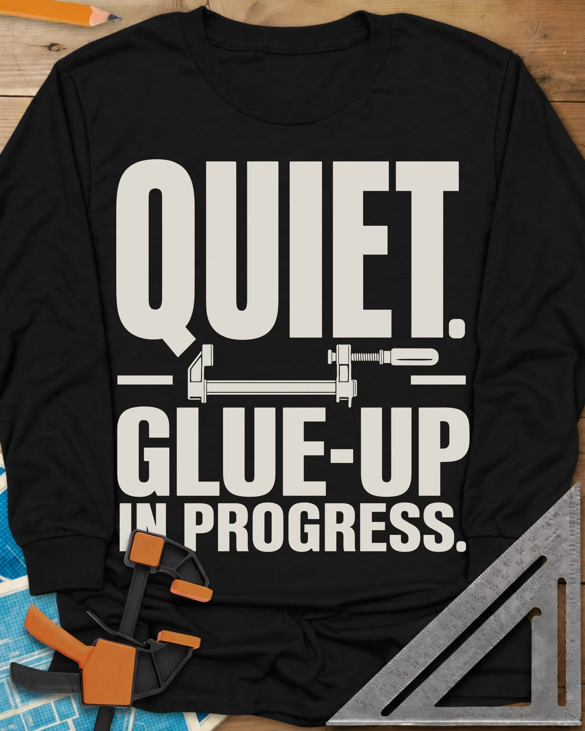 Glue-Up long sleeve shirt in Black, a small bar clamp icon between bold lines of text