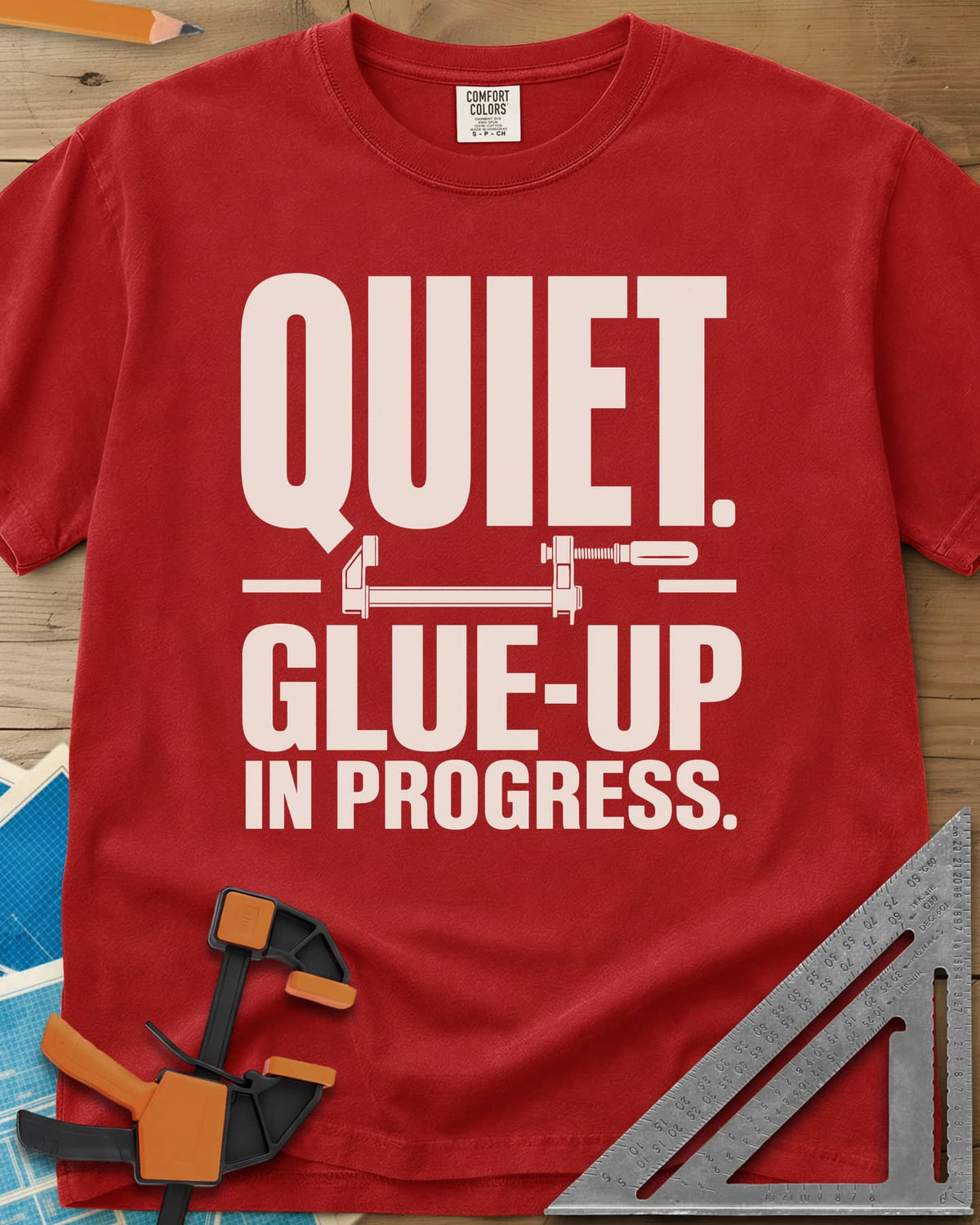 Glue-Up heavyweight tee in Red, a small bar clamp icon between bold lines of text