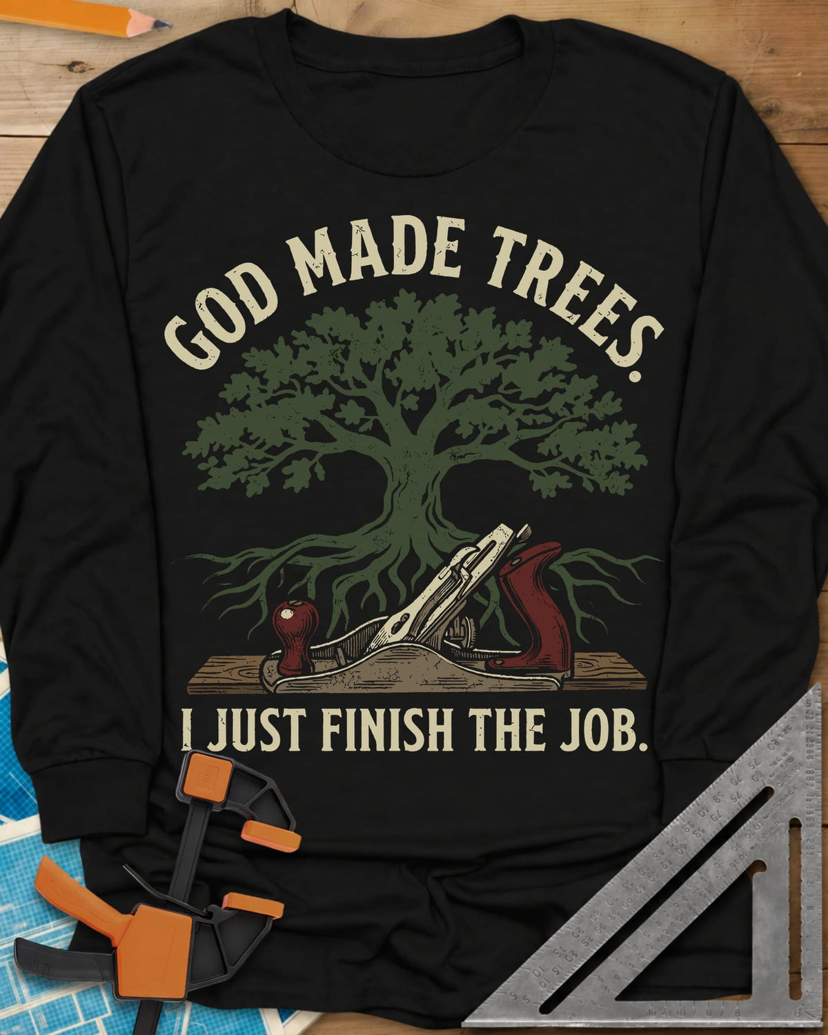 God Made Trees long sleeve shirt in Black, an oak tree with roots over a hand plane resting on a board