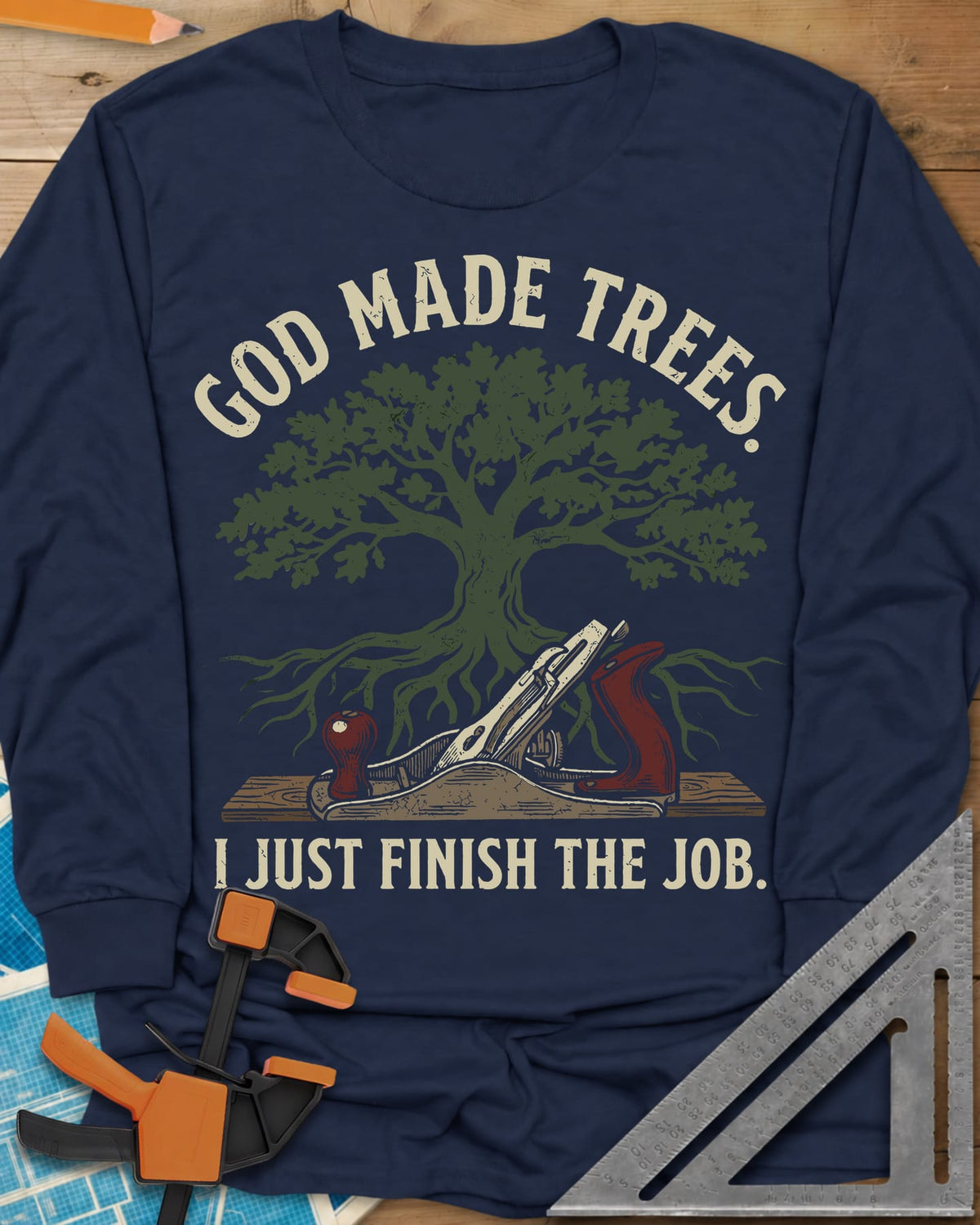 God Made Trees long sleeve shirt in Navy, an oak tree with roots over a hand plane resting on a board