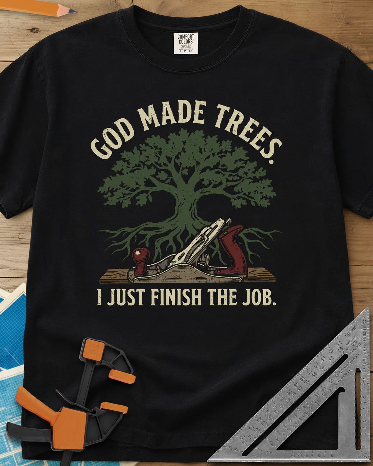 God Made Trees heavyweight tee in Black, an oak tree with roots over a hand plane resting on a board