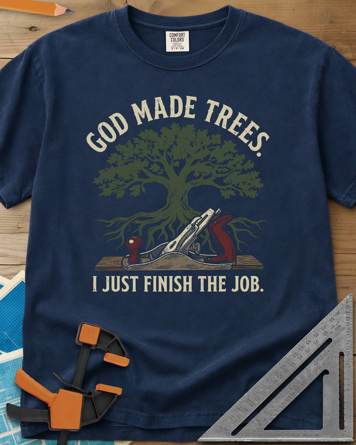 God Made Trees heavyweight tee in Navy, an oak tree with roots over a hand plane resting on a board