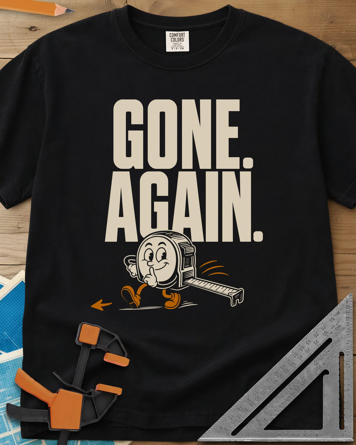 Gone Again heavyweight tee in Black, a cartoon tape measure tiptoeing off with a finger to its lips
