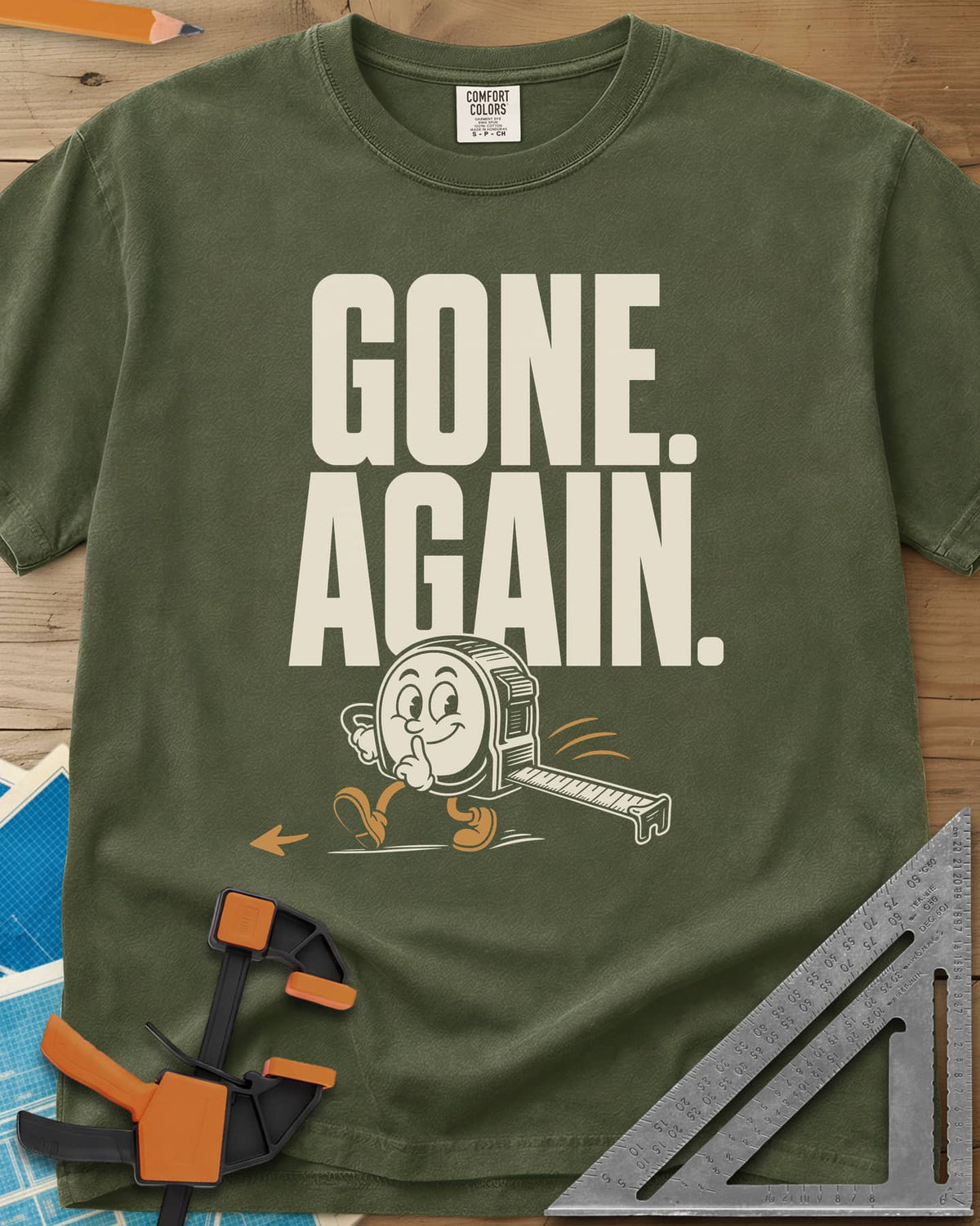 Gone Again heavyweight tee in Hemp, a cartoon tape measure tiptoeing off with a finger to its lips
