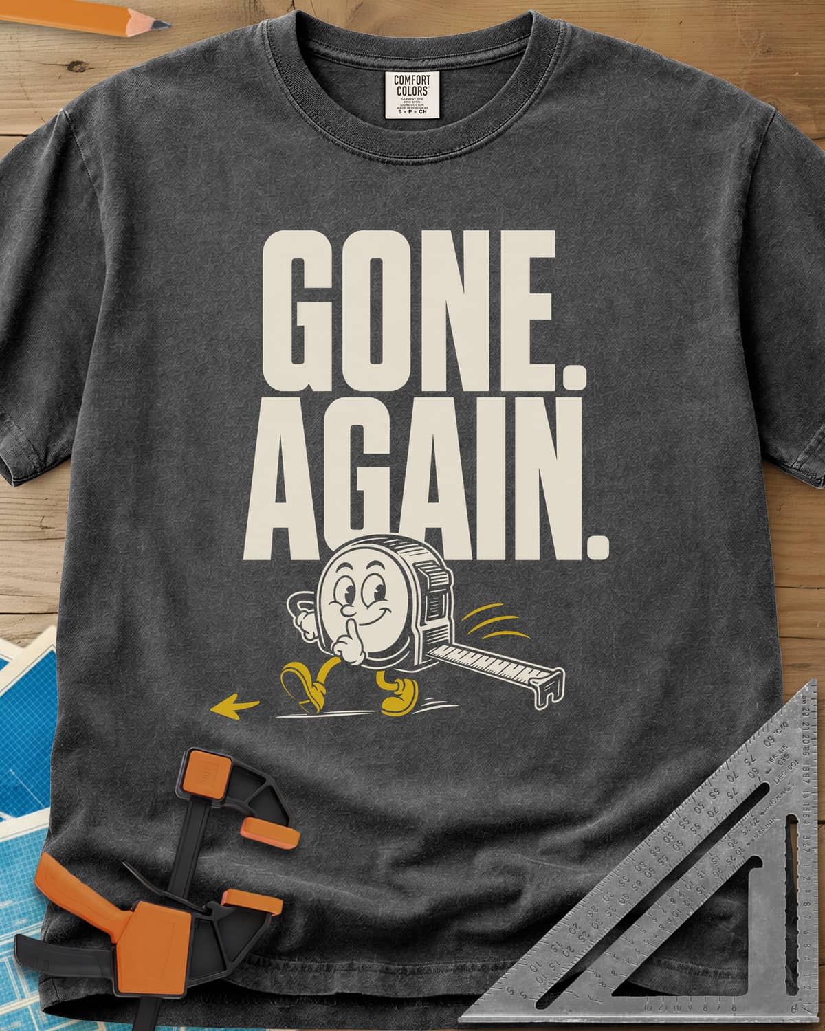 Gone Again heavyweight tee in Pepper, a cartoon tape measure tiptoeing off with a finger to its lips