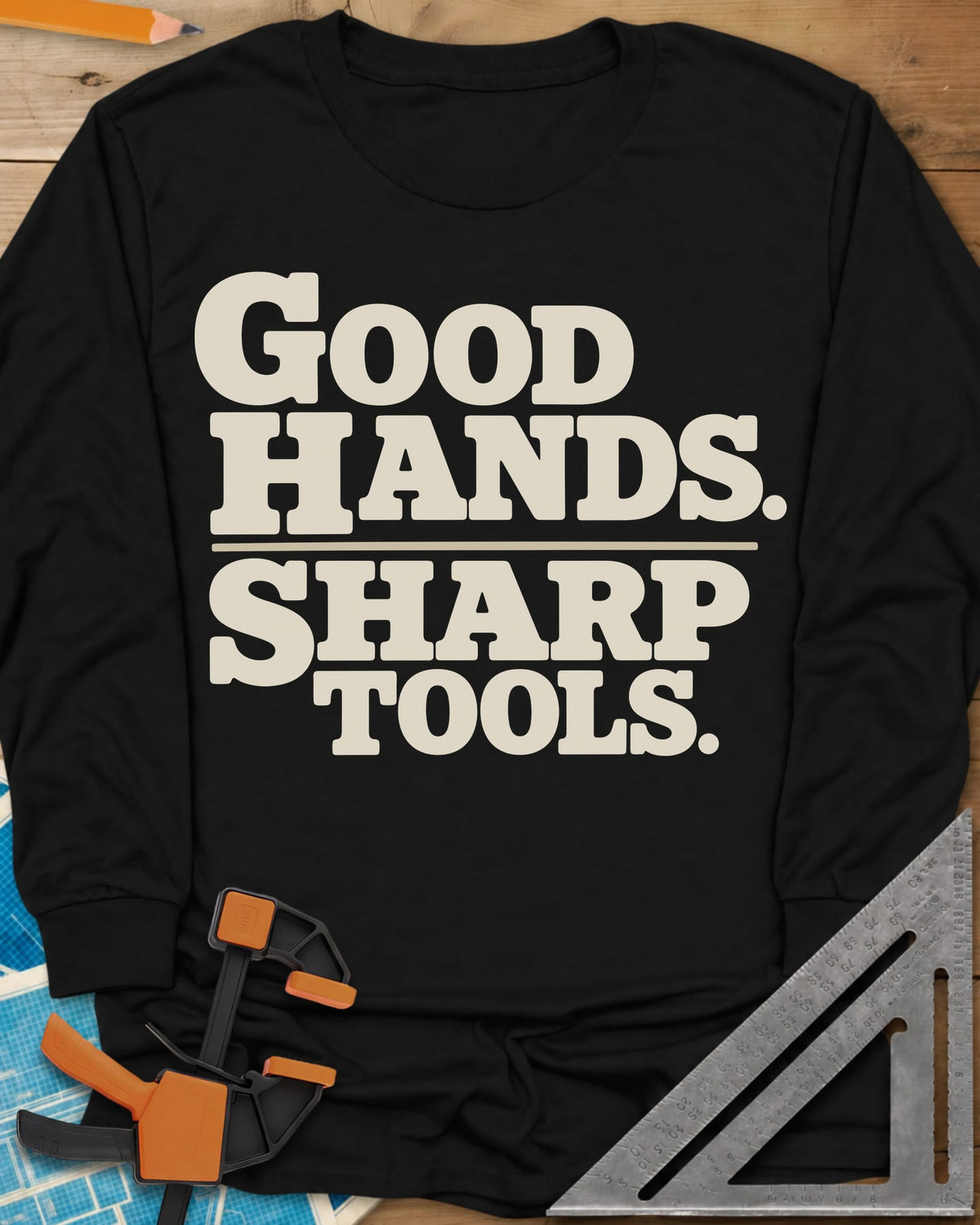 Good Hands long sleeve shirt in Black, two lines of heavy slab-serif lettering split by a thin rule