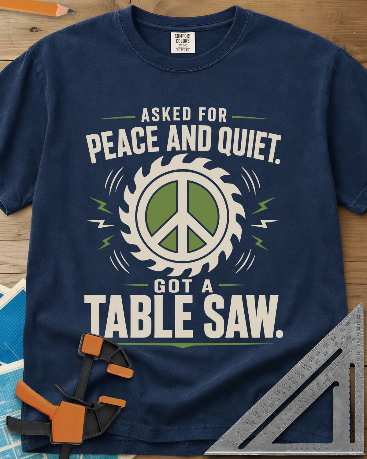 Got A Table Saw heavyweight tee in Navy, a peace sign inside a round saw blade with sound bursts