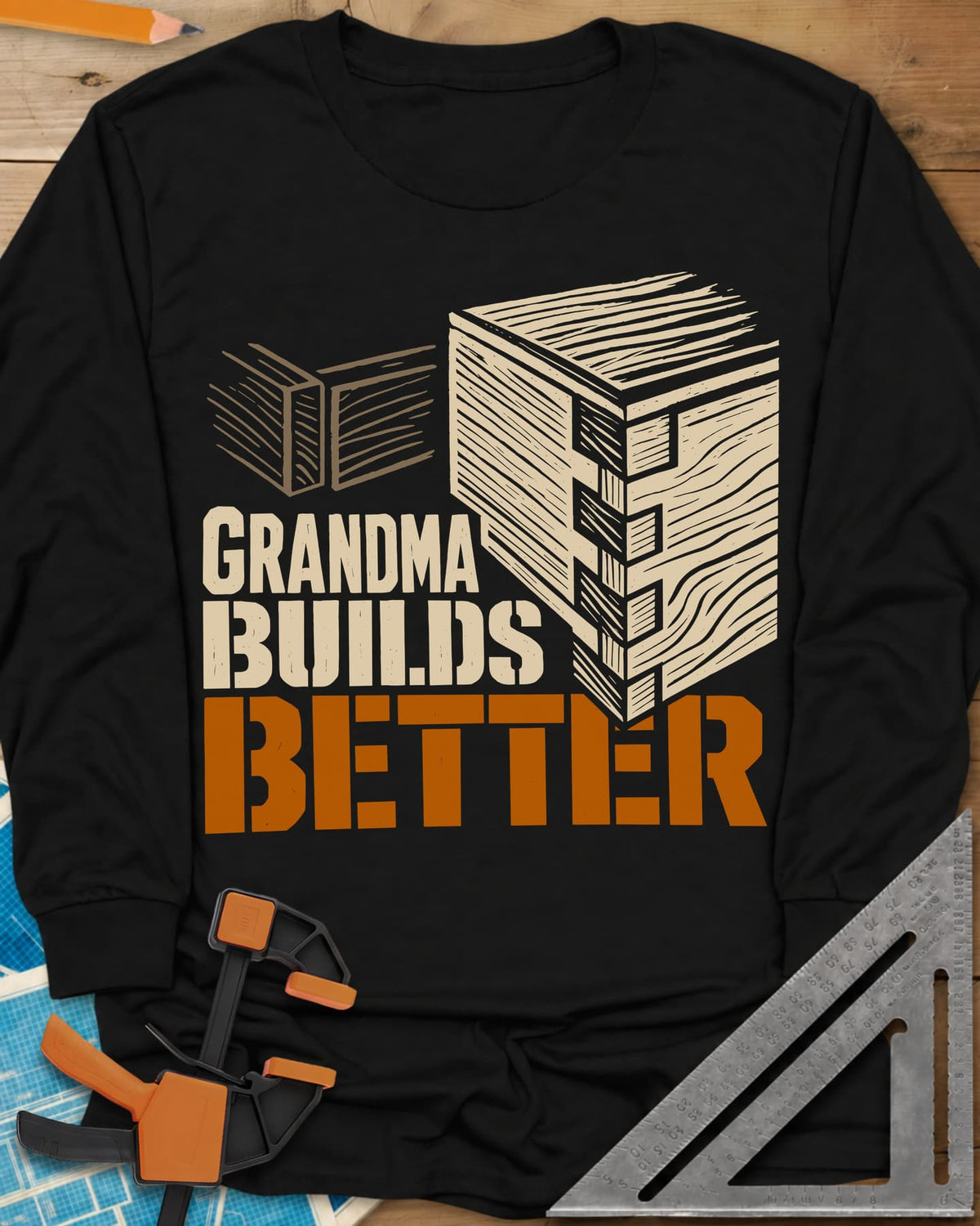 Grandma Builds long sleeve shirt in Black, a woodcut-style joined box corner next to two loose boards