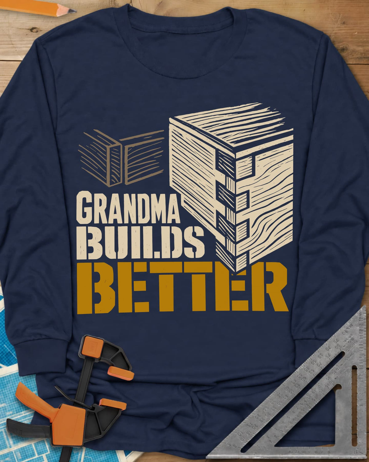 Grandma Builds long sleeve shirt in Navy, a woodcut-style joined box corner next to two loose boards