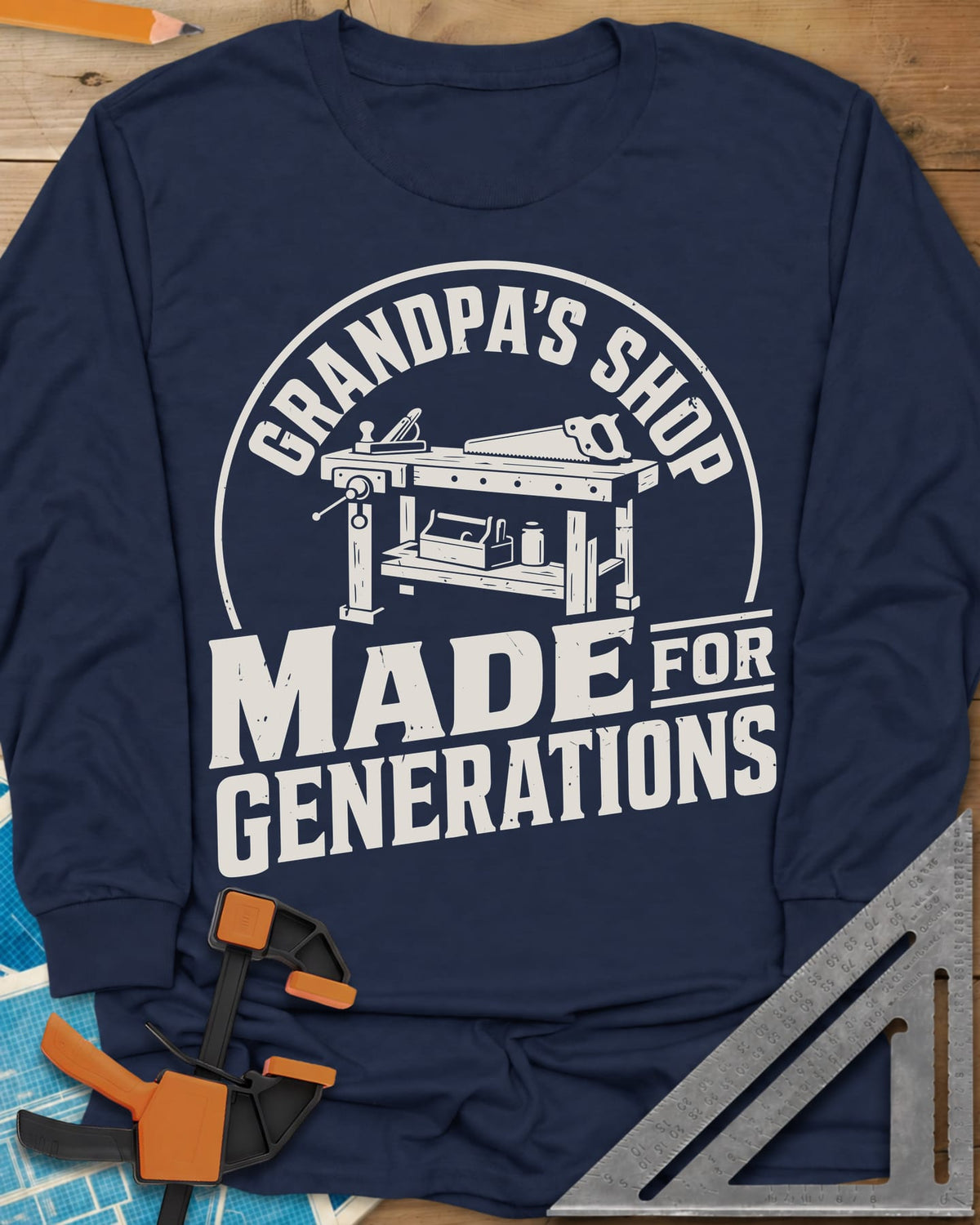 Grandpa'S Shop long sleeve shirt in Navy, arched title over a workbench with a plane, handsaw and toolbox